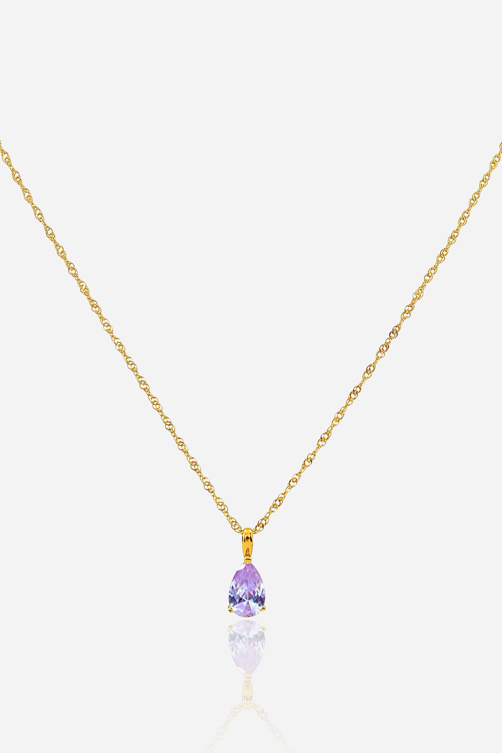 Close-up of pear-cut light amethyst zircon birthstone pendant in 18K gold plating – GLISTIA