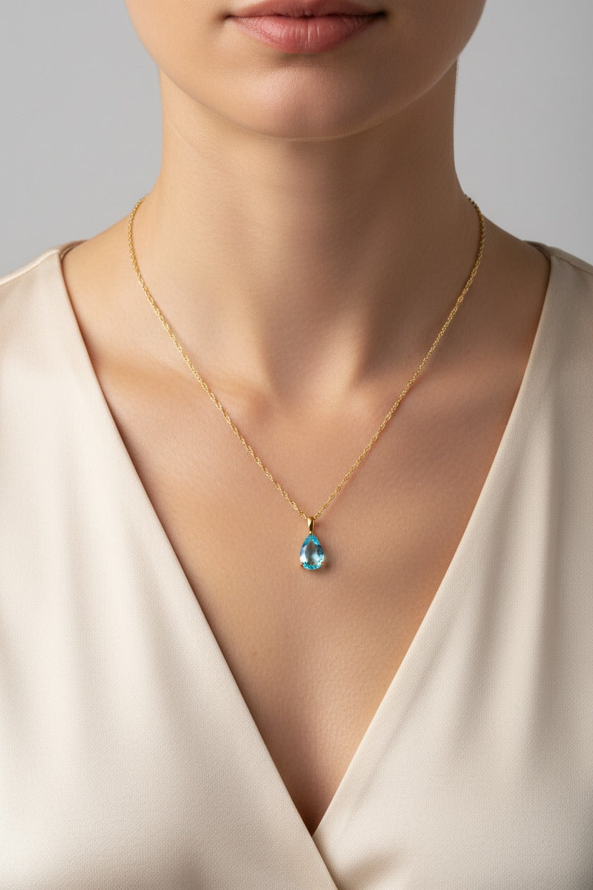 Aqua birthstone necklace for March with light blue zircon teardrop pendant in 18K PVD gold plated stainless steel