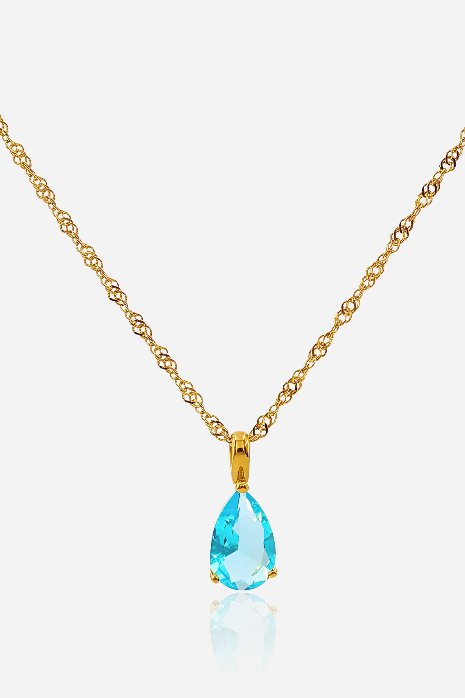 Top view of Aqua Birthstone Necklace with teardrop aqua blue zircon and gold plated chain – GLISTIA.