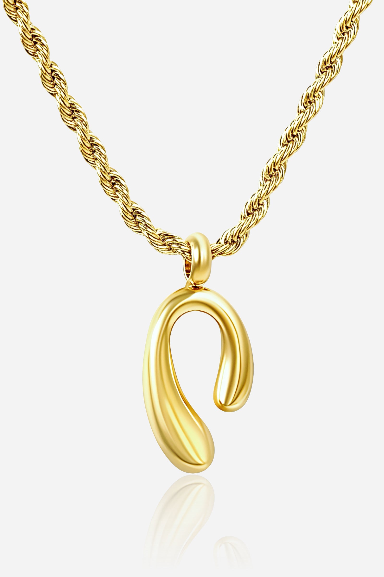 Close-up of GLISTIA Auric Curve Necklace showcasing the smooth curved pendant with high-gloss 18K gold plating.