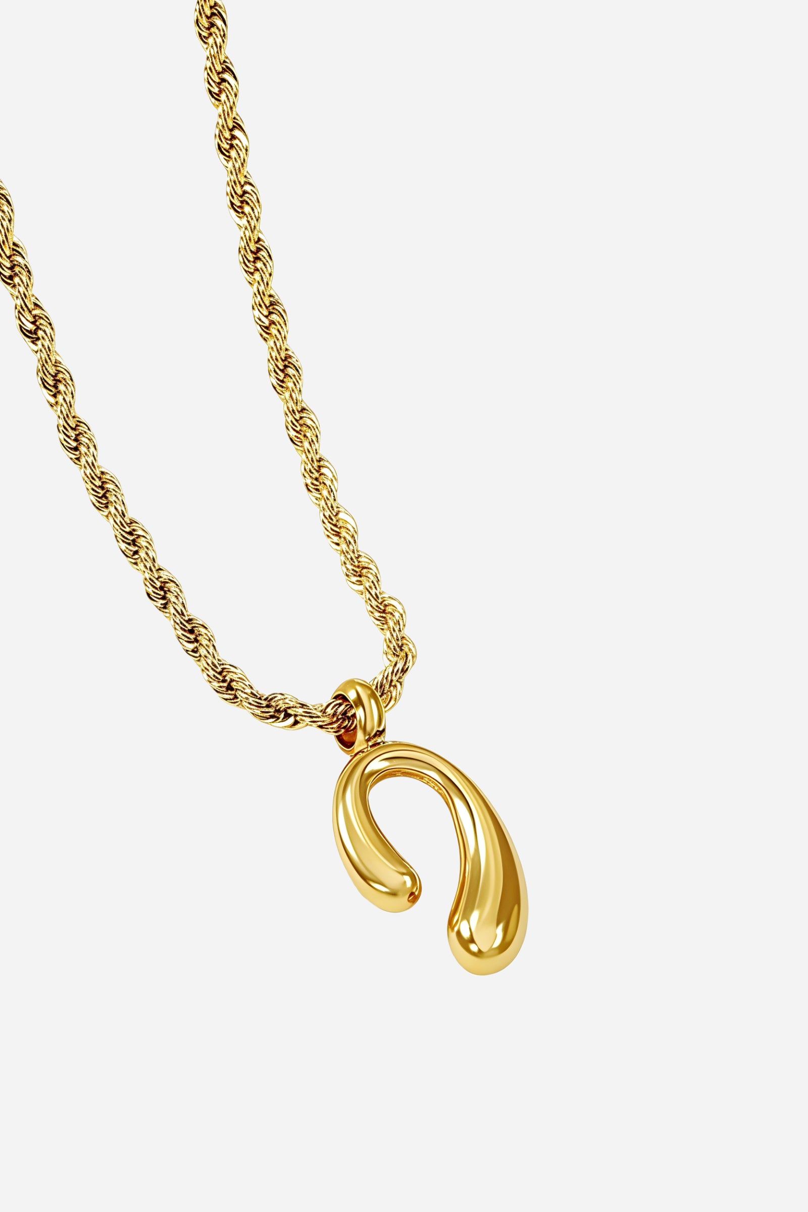 Front view of GLISTIA Auric Curve Pendant Necklace featuring a fluid gold abstract charm on a twisted rope chain.