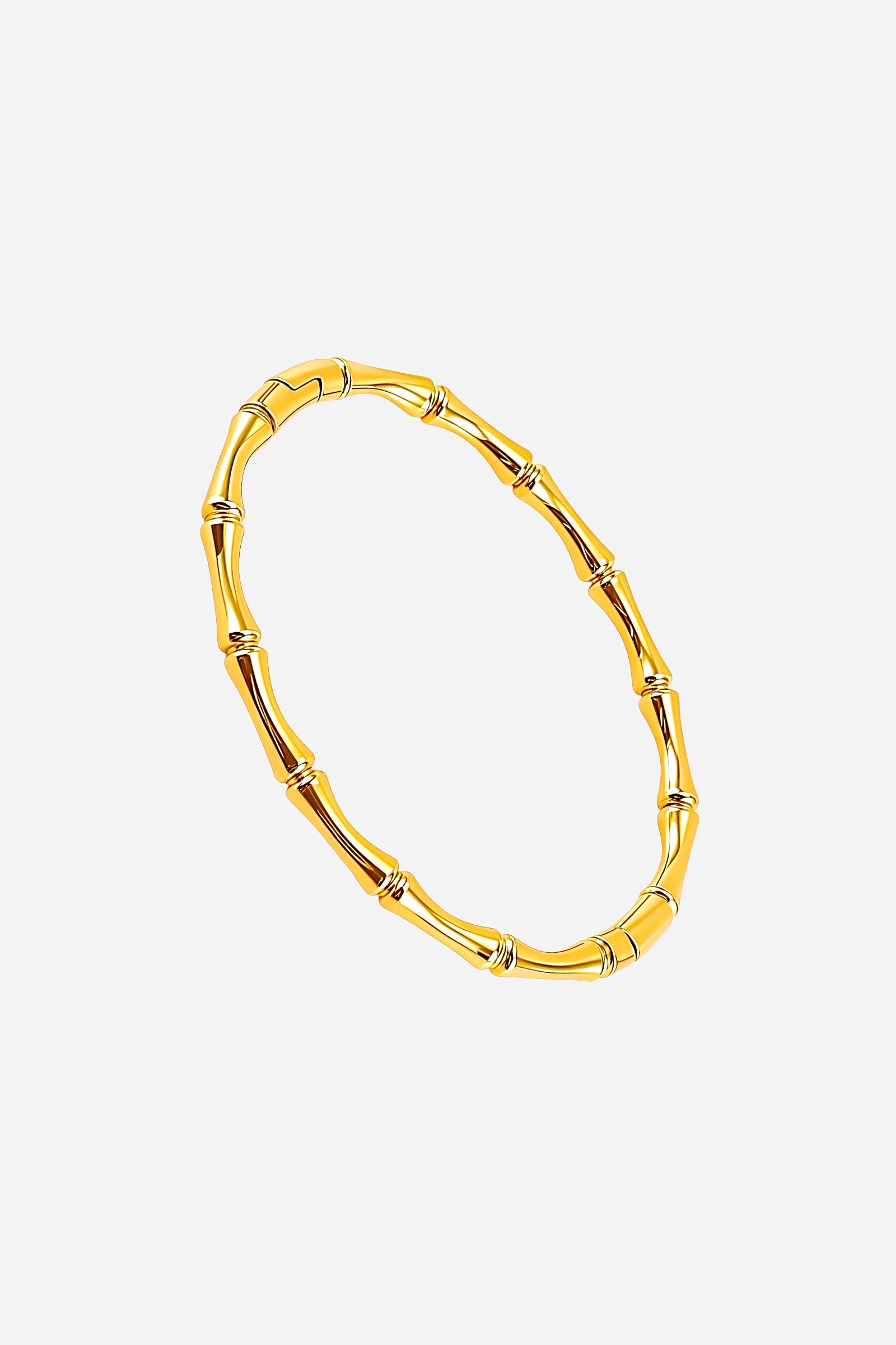 Side view showing the smooth curvature and detailed bamboo joint pattern of the PVD 18K gold-plated stainless steel bangle – GLISTIA.