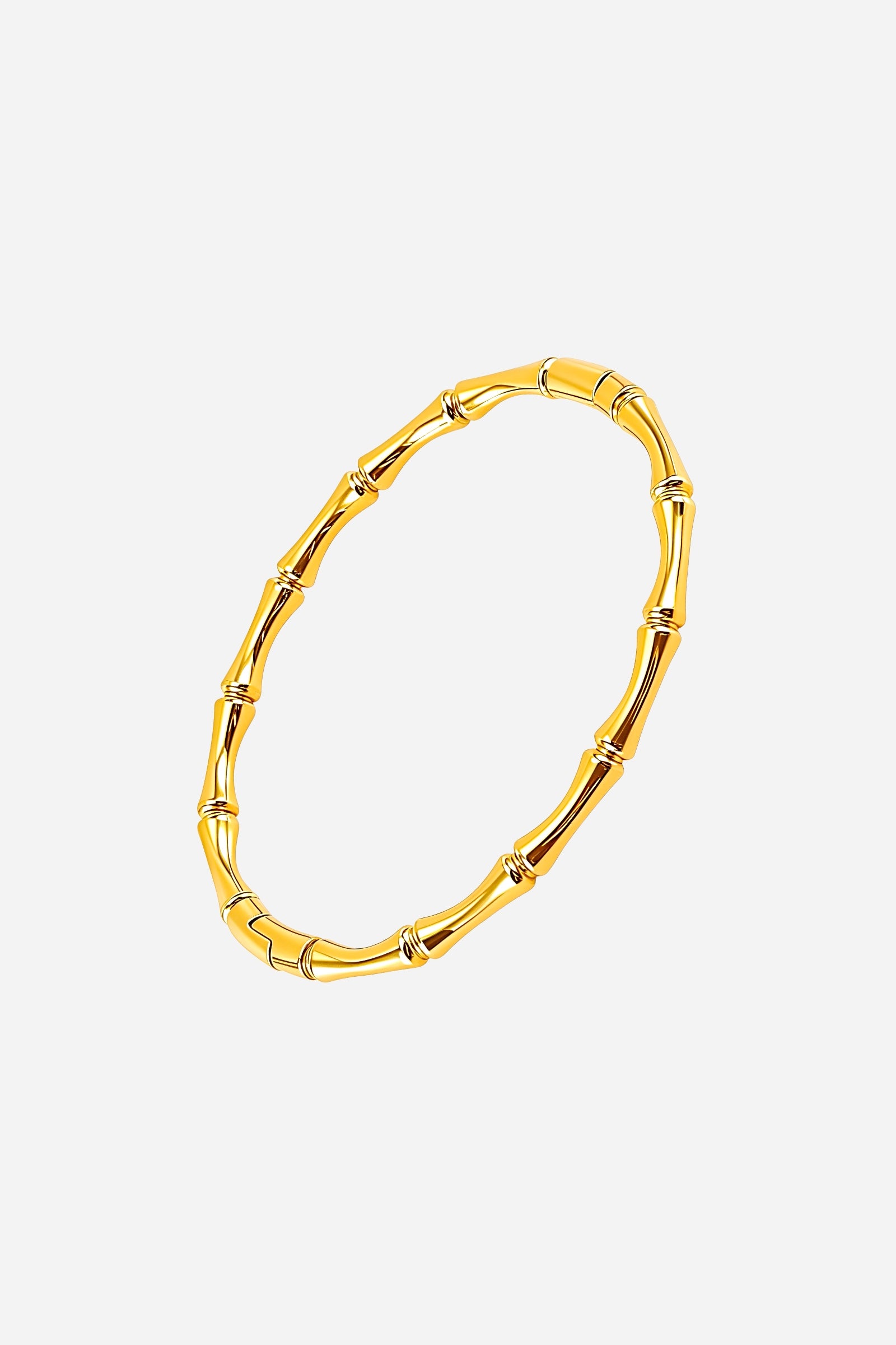 Top view highlighting the organic bamboo texture and elegant polished gold finish of this stainless steel bangle – GLISTIA.