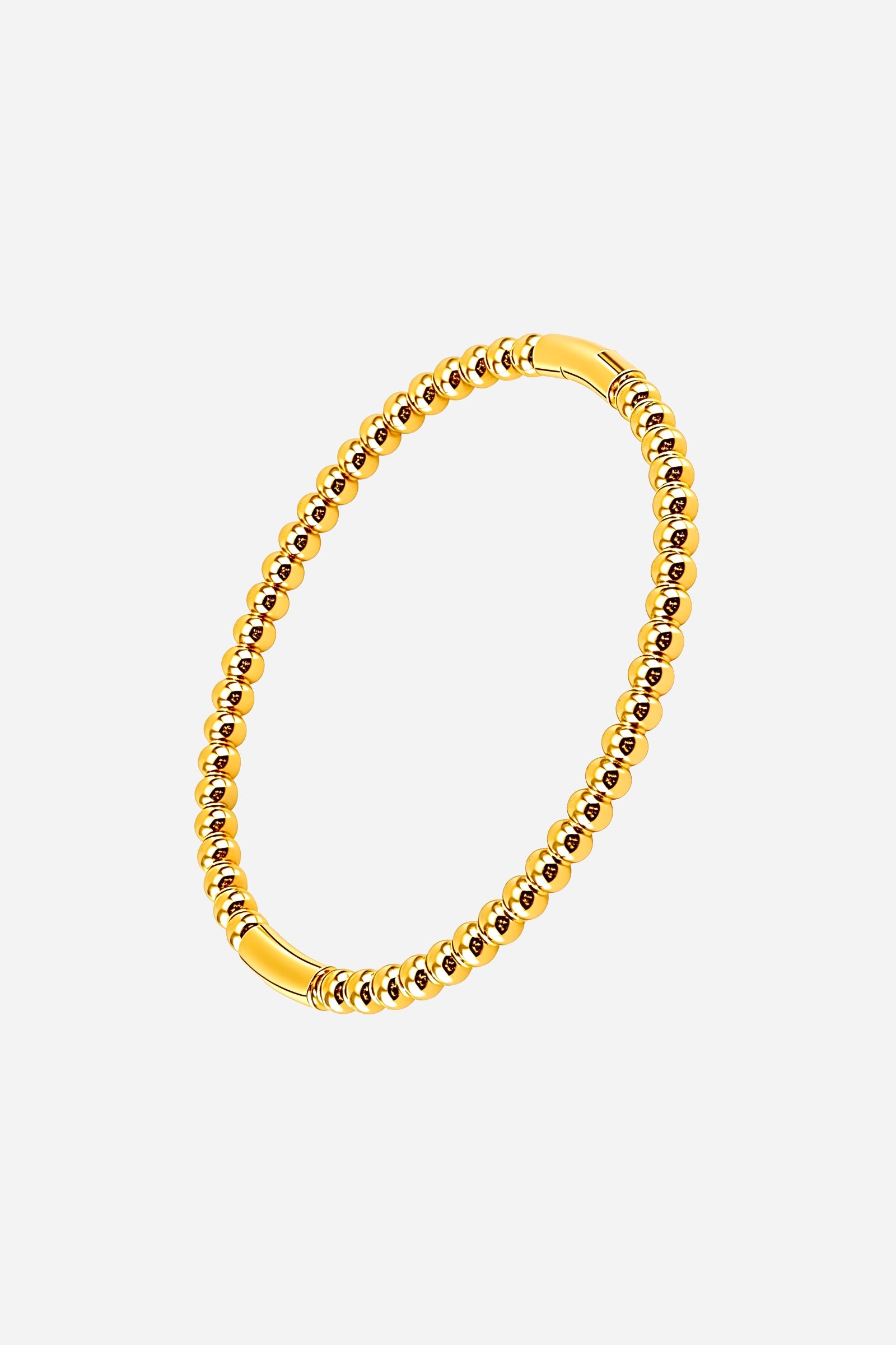 Side view of the 18K gold plated Beaded Sphere Bangle showing its polished rounded bead texture and smooth symmetry - GLISTIA.