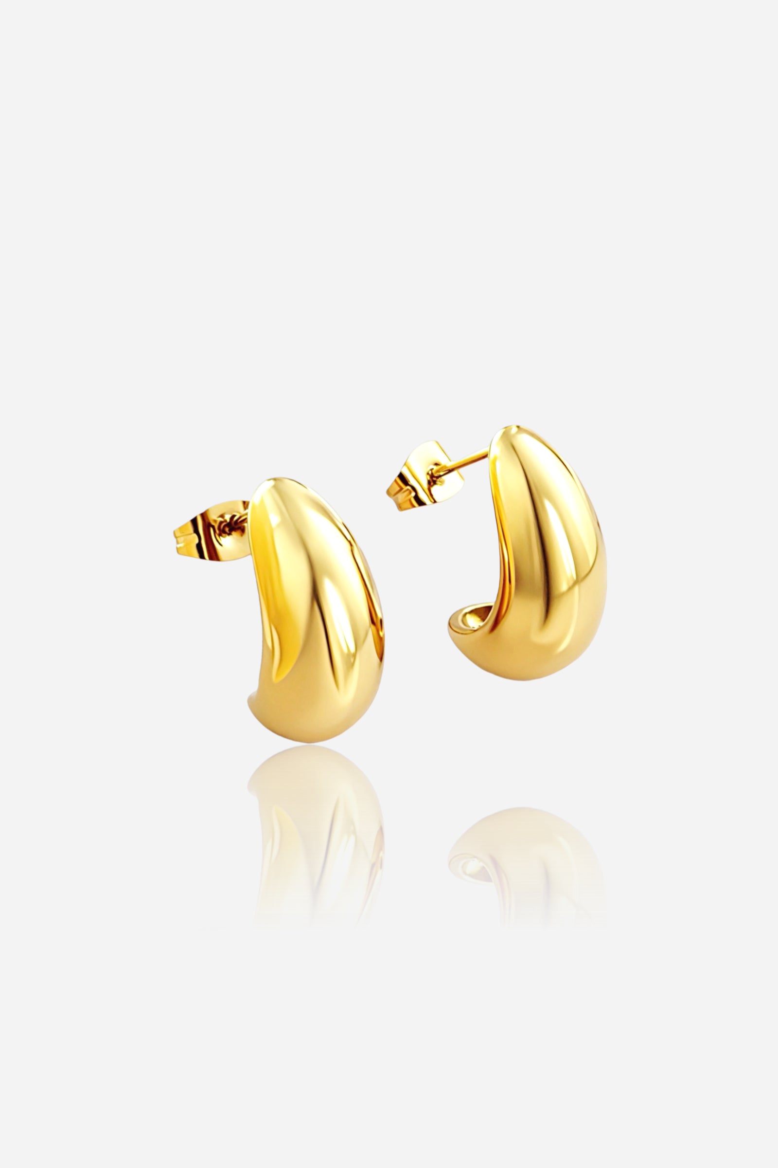 Front view of bold dome-shaped hoop earrings crafted from stainless steel with a smooth, mirror-polished PVD 18K gold plated finish, reflecting a modern and elegant style – GLISTIA.