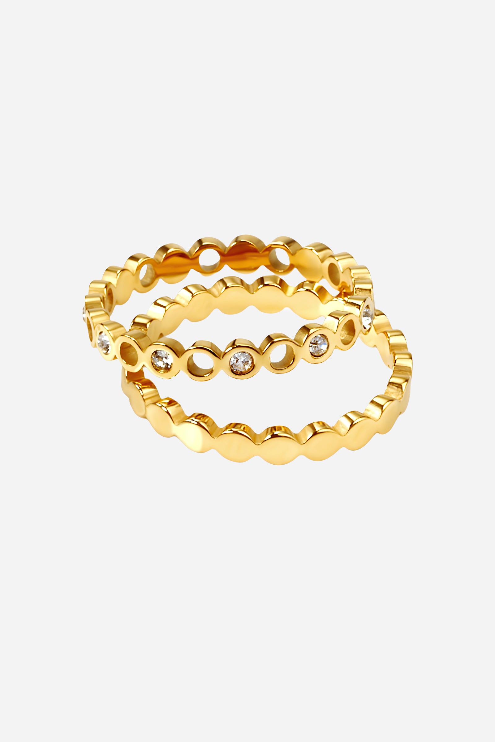 Top-view of GLISTIA Circle Crystal Band Ring featuring polished gold circles and embedded crystals.
