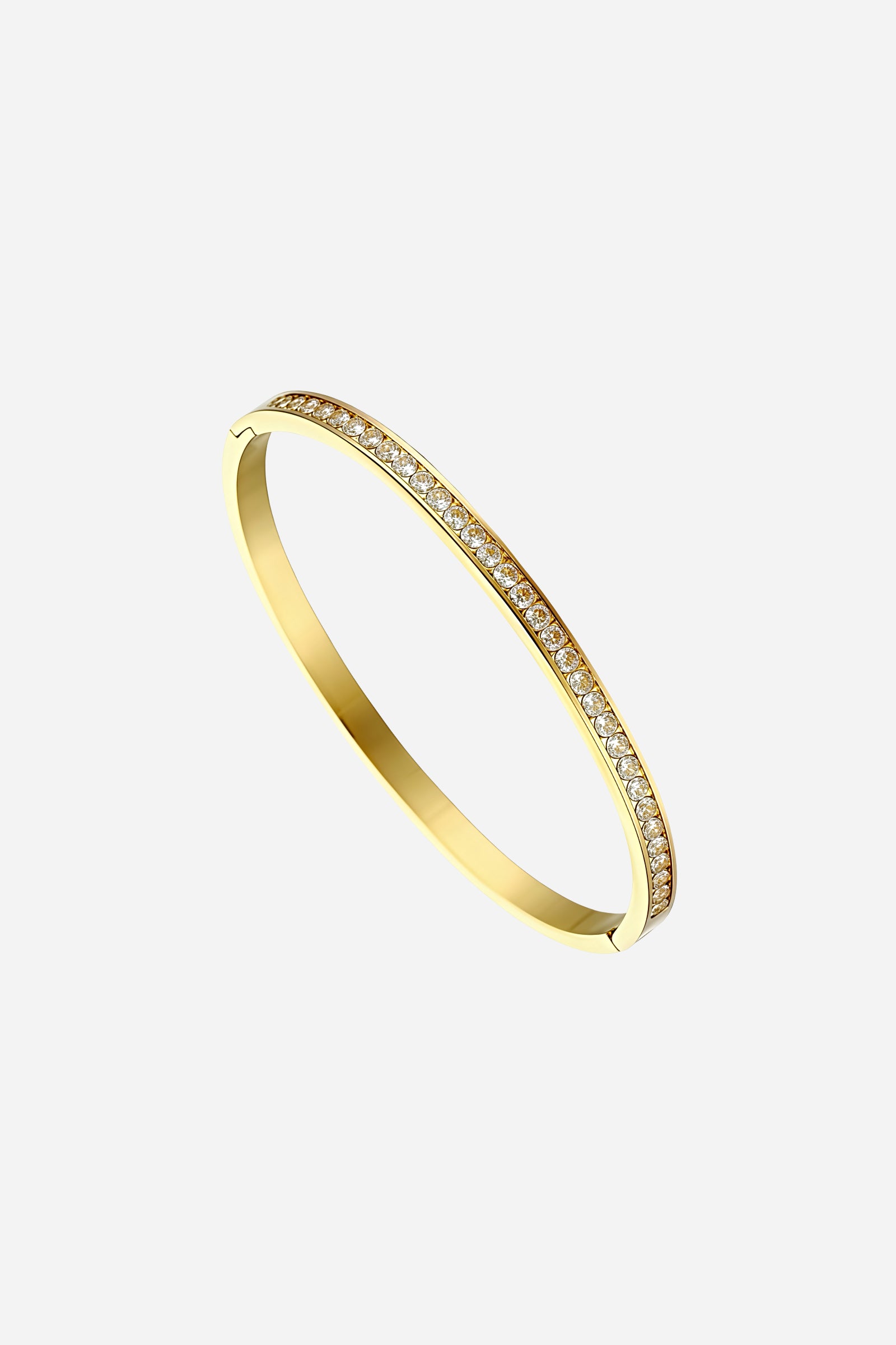 Side view highlighting the smooth plain back and sleek curved shape of the Crystal Bar Bangle in polished 18K gold PVD plating – GLISTIA.