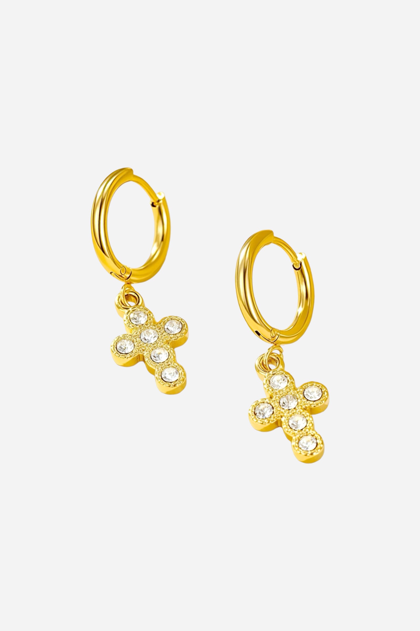 Side angle view of crystal cross charm hoop earrings crafted from stainless steel with a radiant PVD 18K gold plated finish, featuring mini hoops with crystal-embellished cross pendants - GLISTIA.