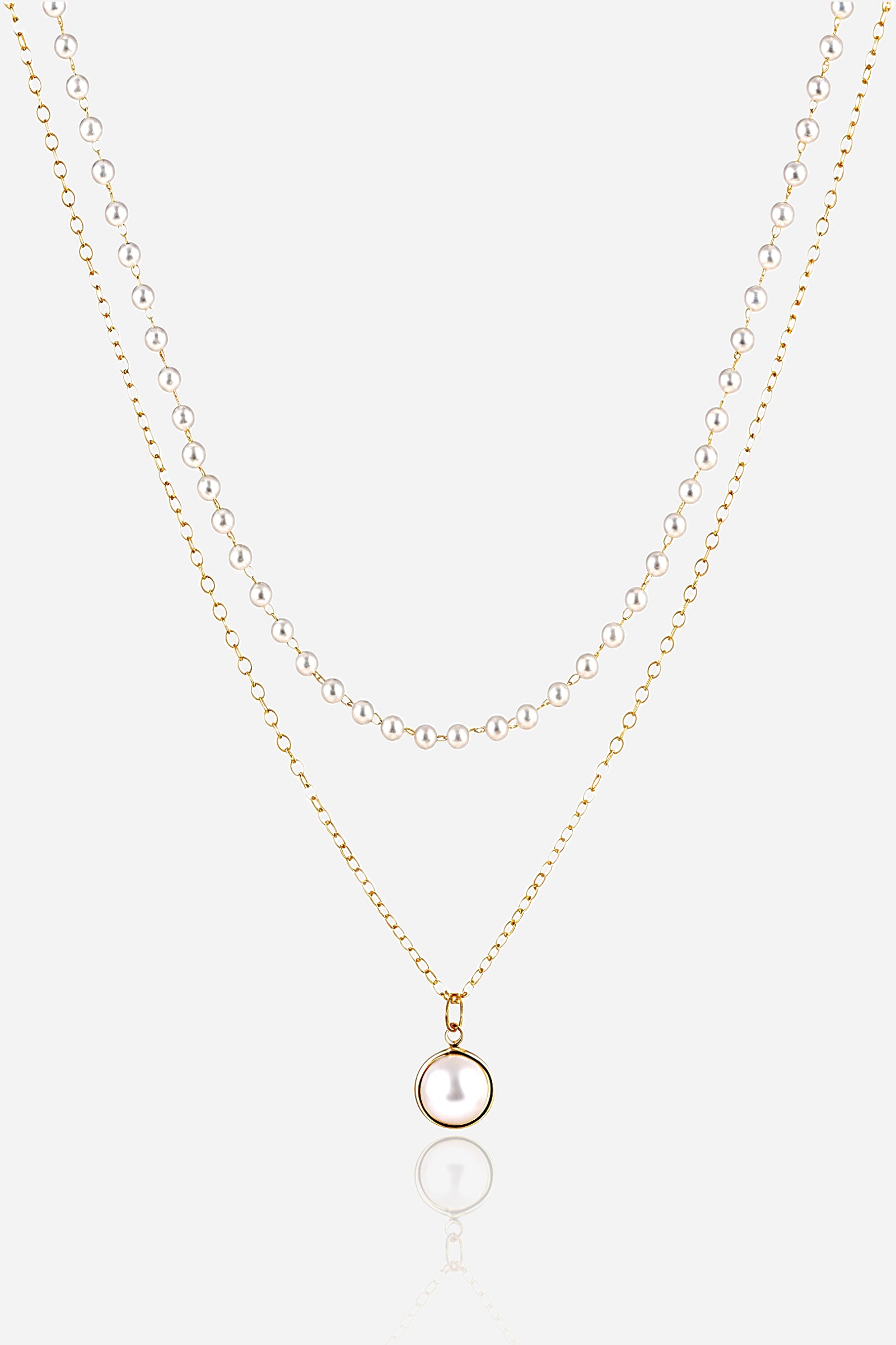Double layer pearl pendant necklace with gold-plated stainless steel chain, featuring a round pearl charm and pearl beaded layer – GLISTIA.