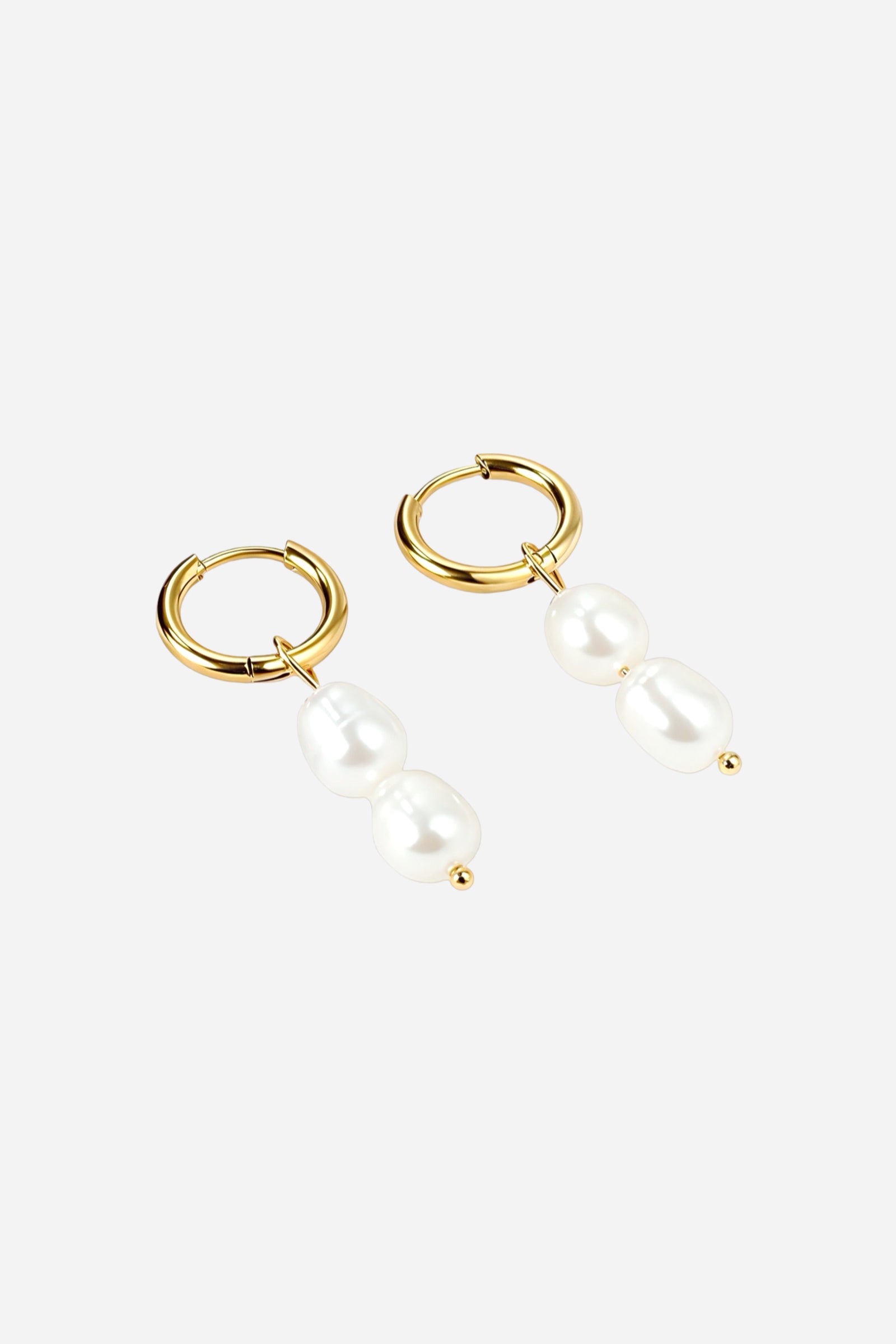 Side view of double pearl drop huggie earrings made from stainless steel with lustrous PVD 18K gold plating, featuring two white pearls elegantly suspended from classic hoops – GLISTIA.