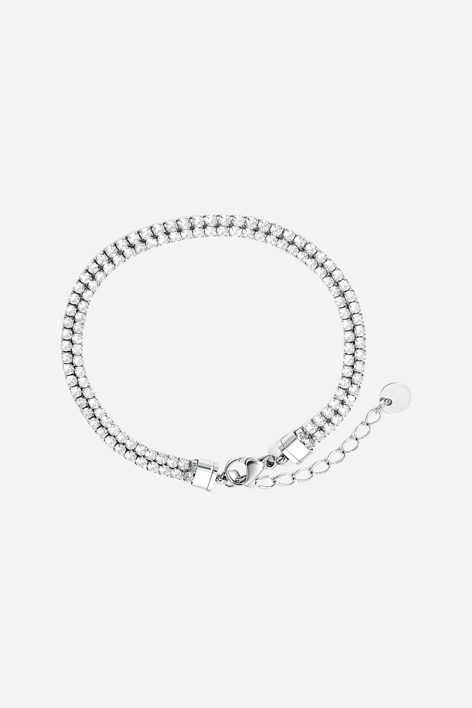 Side view of polished silver dual row crystal tennis bracelet with crystal detailing – GLISTIA