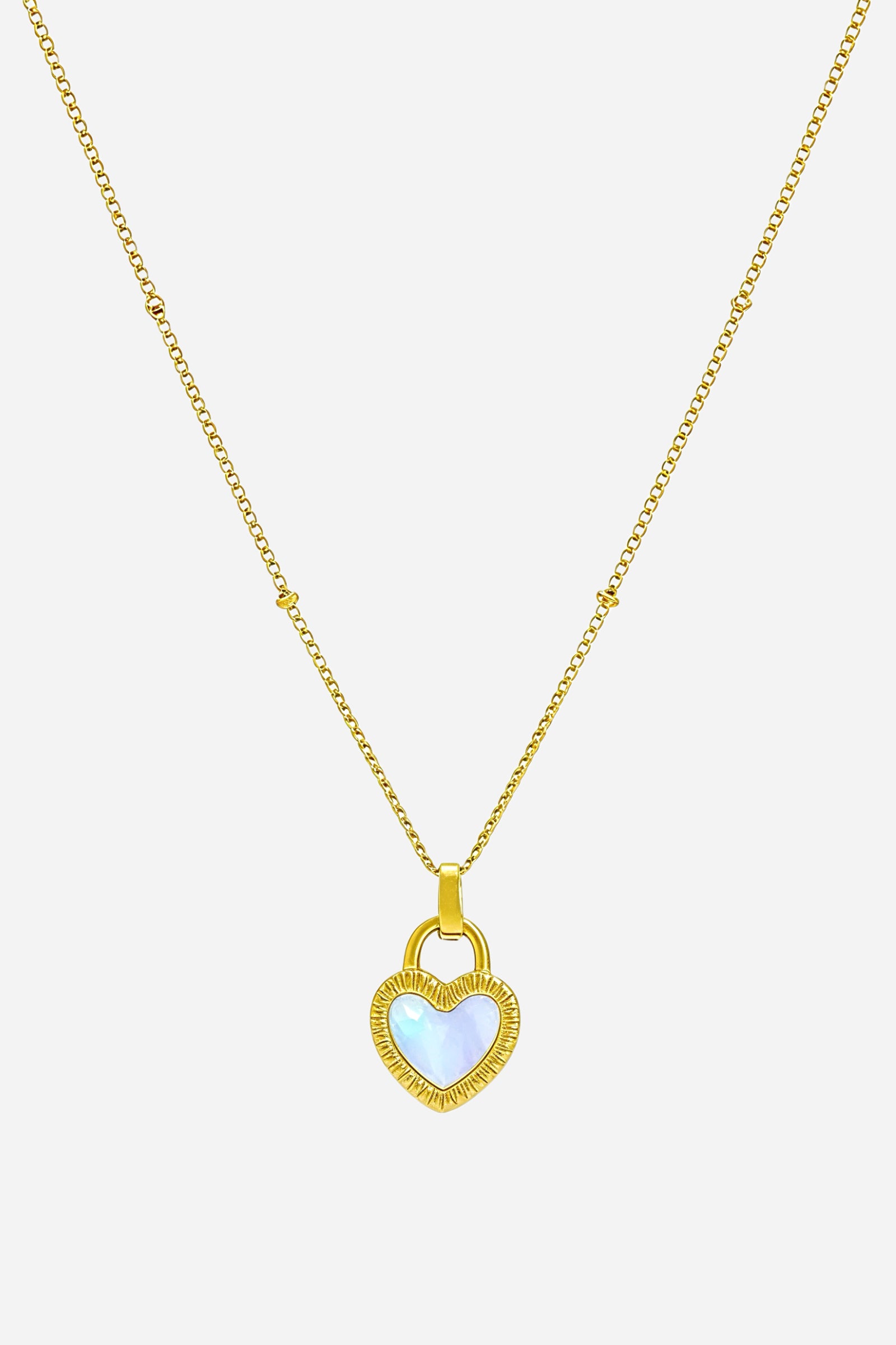 Top view of dual-sided heart pendant necklace with black and white heart detail – GLISTIA