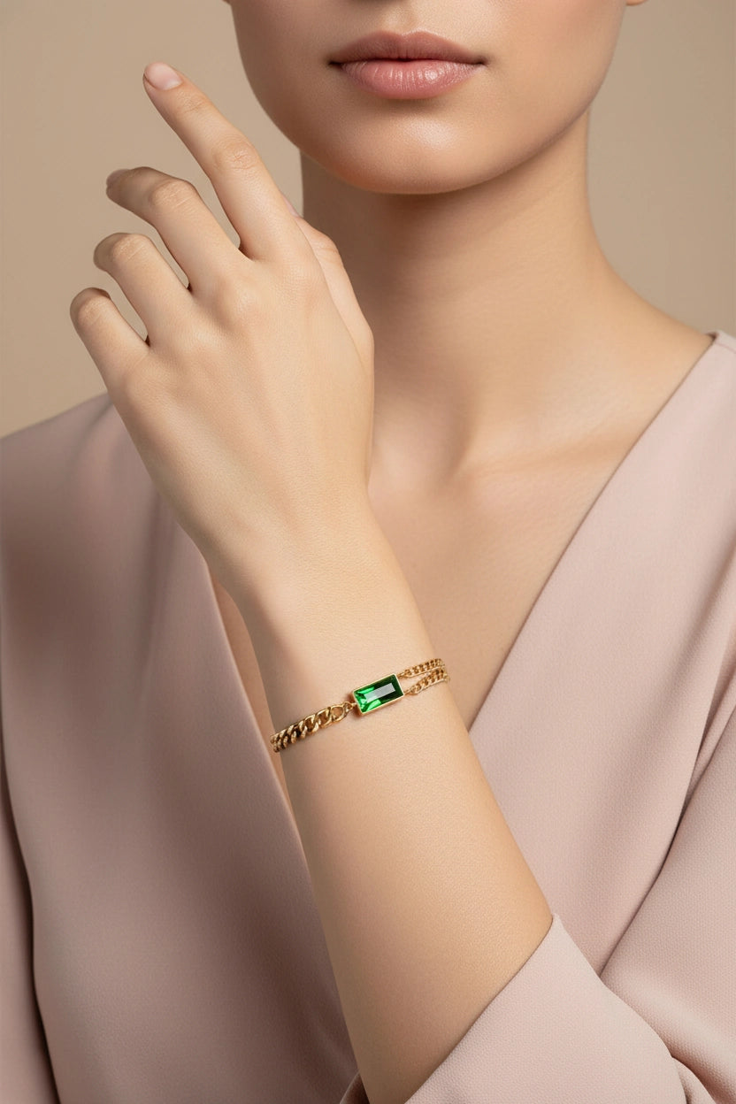 Emerald Glow dual chain bracelet in 18K PVD gold plated stainless steel with refined green crystal detail