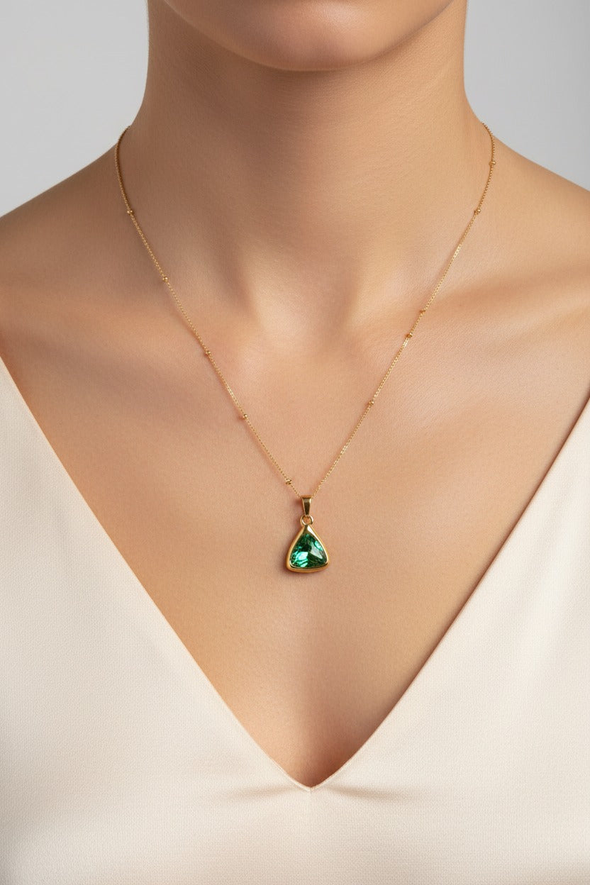 Emerald Radiance pendant necklace with triangular emerald green cubic zirconia, 18K PVD gold plated stainless steel by GLISTIA