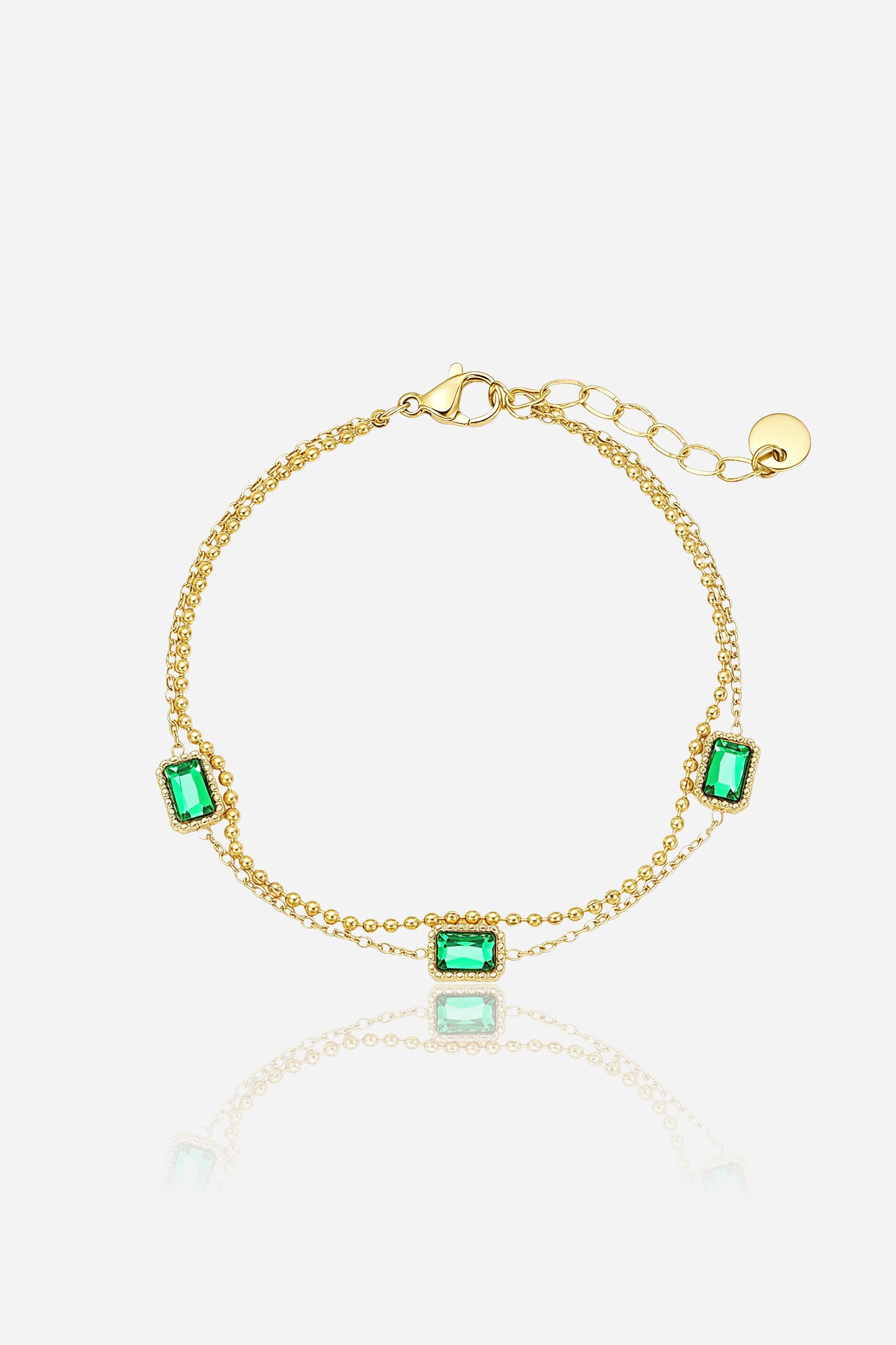 GLISTIA emerald rectangular stone chain bracelet in PVD 18K gold plated stainless steel shown from the front.