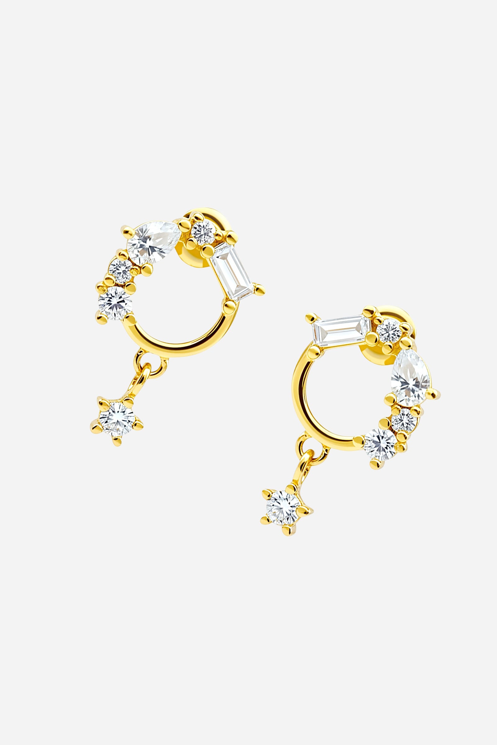 Side view of PVD 18K gold plated Crystal Baguette Circle Piercing Earring featuring baguette and round CZ stones - GLISTIA