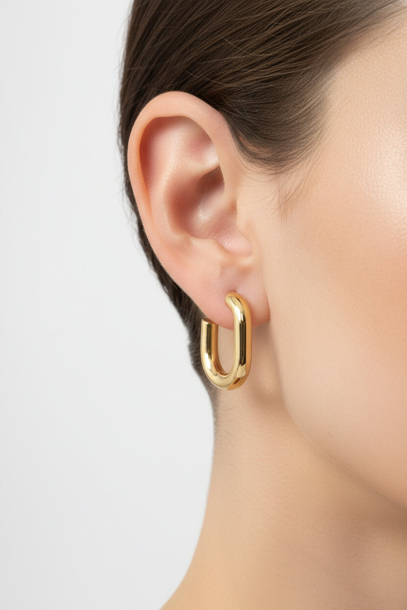 Close-up of GLISTIA Elara gold hoop earrings crafted in stainless steel with 18K PVD gold plating