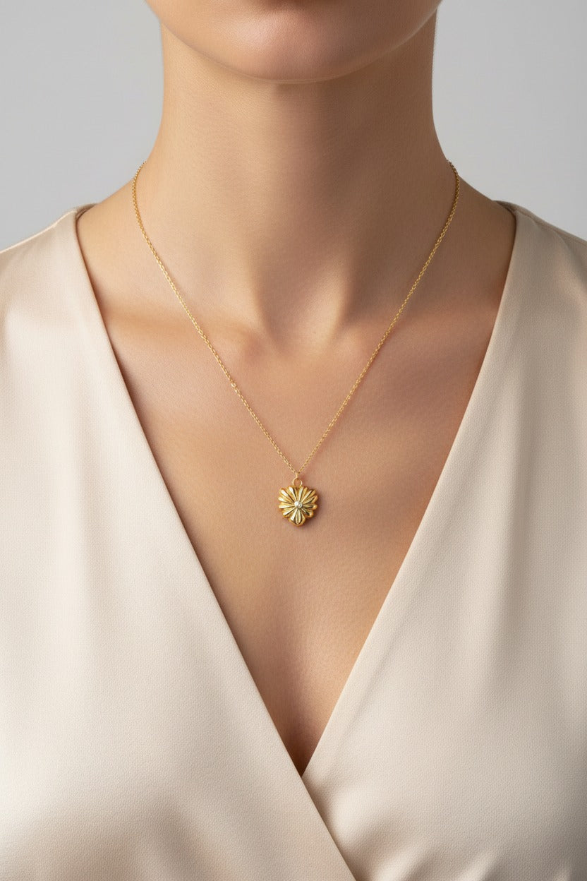 Gold Blossom Pendant Necklace crafted from stainless steel with 18K PVD gold plating, worn on model neckline