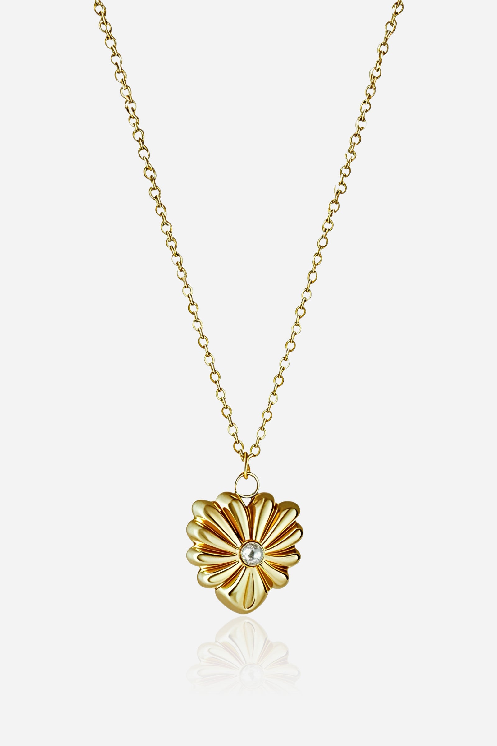 Detailed image of GLISTIA gold blossom pendant highlighting the polished petals and central pearl.