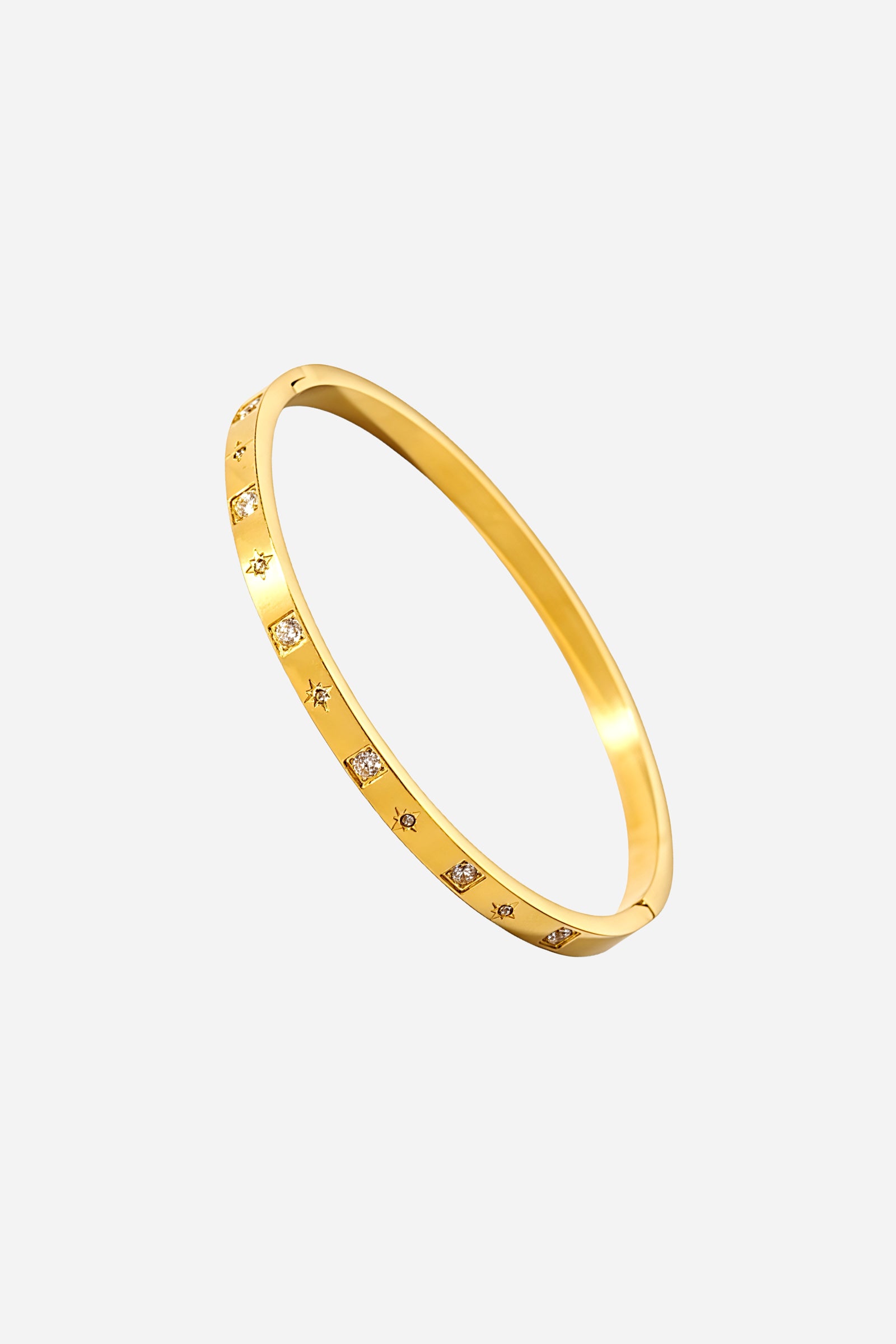 Top angle of GLISTIA 18K gold plated bangle highlighting its sleek circular form and sparkling cubic zirconia embellishments that reflect modern minimal elegance."