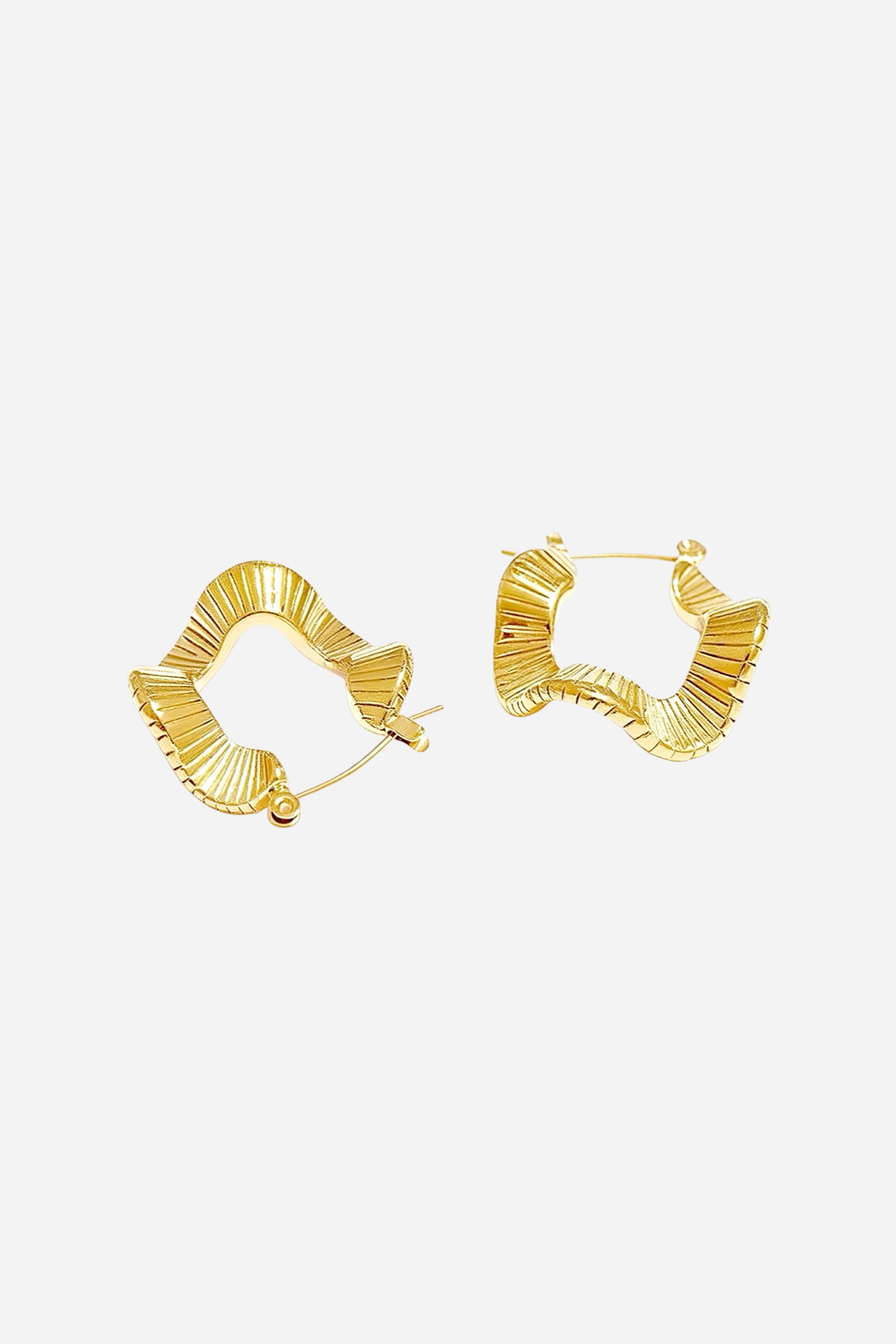 Side view of 18K gold plated geometric ripple hoop earrings crafted from stainless steel with wavy sculptural texture – GLISTIA jewellery