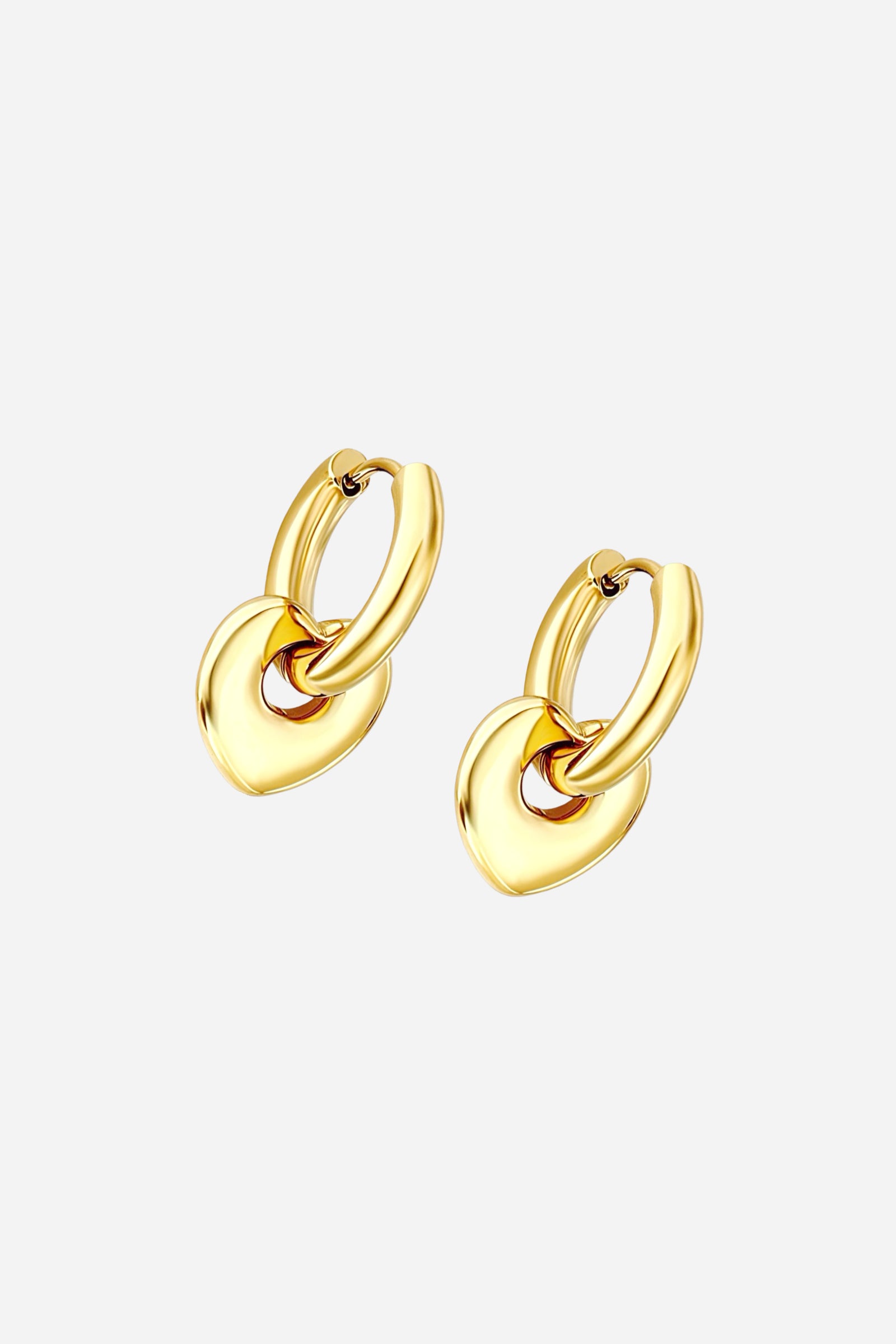 Angled view of gold heart charm hoop earrings crafted from stainless steel with a PVD 18K gold-plated finish, showcasing a smooth hoop and dangling heart charm – GLISTIA.