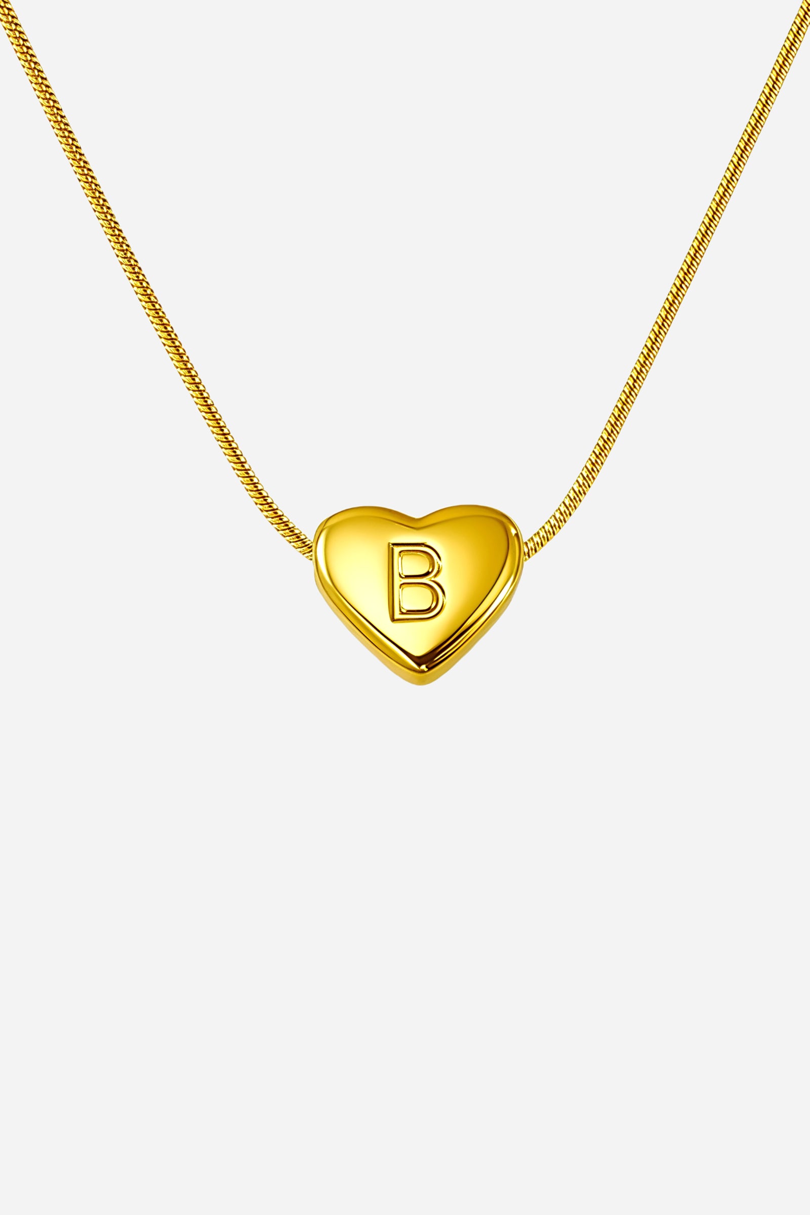 Close-up of gold heart initial ‘B’ pendant on snake chain, PVD 18K gold plated stainless steel – GLISTIA.