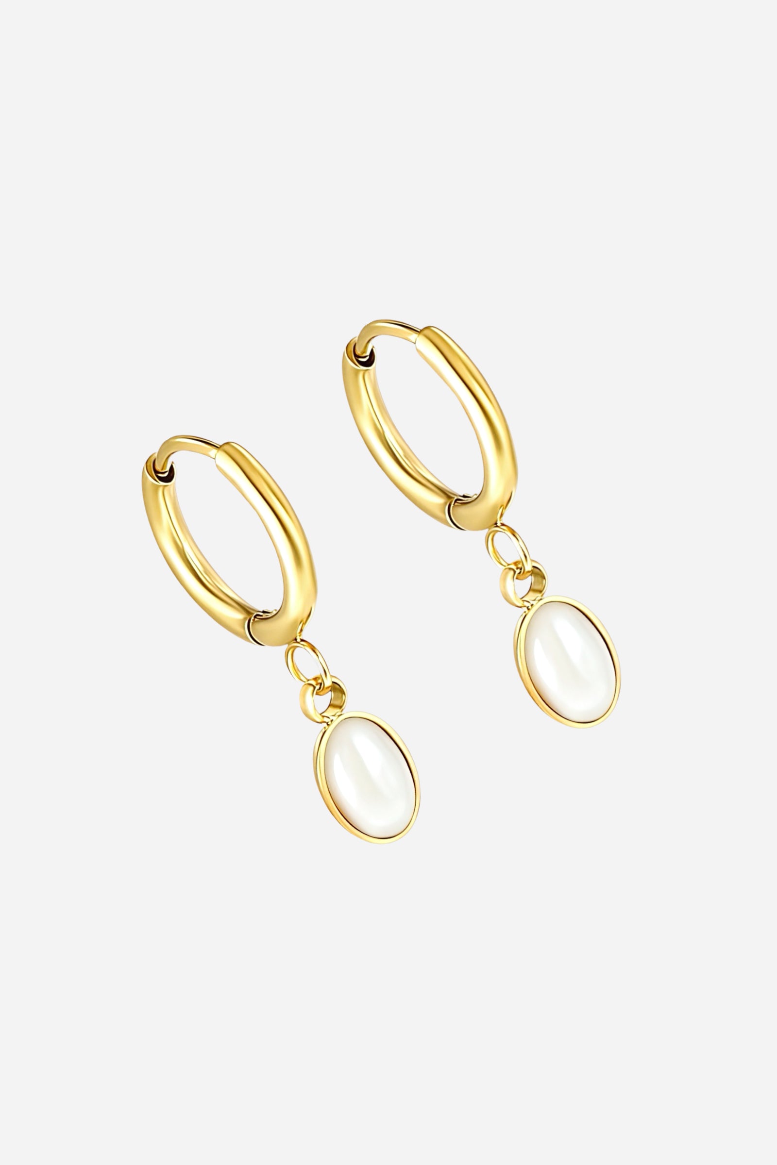 Side view of gold oval pearl drop hoop earrings crafted from stainless steel with a smooth PVD 18K gold plated finish, featuring glossy oval pearl-like pendants and minimalist polished hoops – GLISTIA.