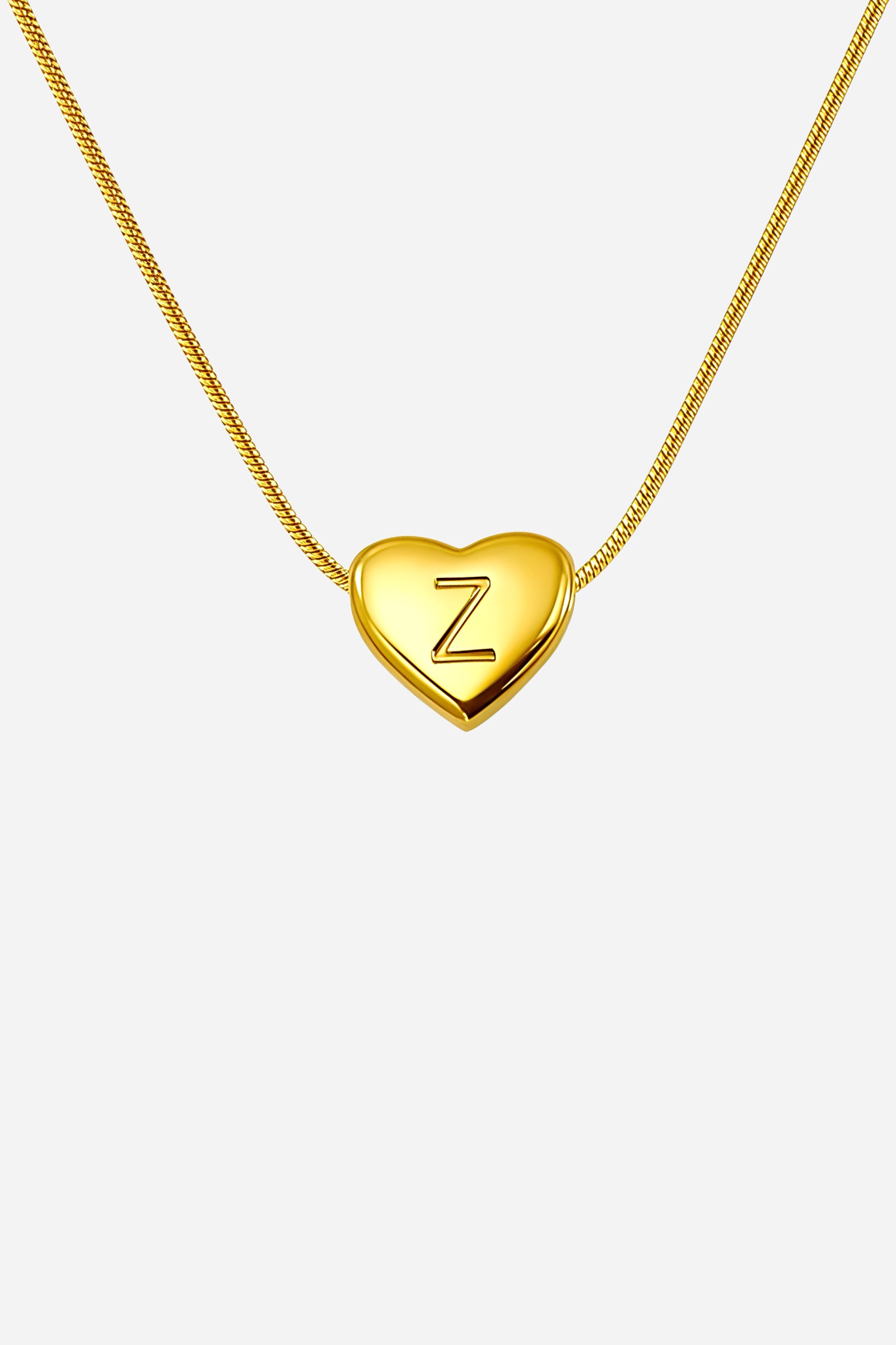 Close-up of heart-shaped initial ‘Z’ pendant highlighting engraved letter and mirror-polished gold finish – GLISTIA