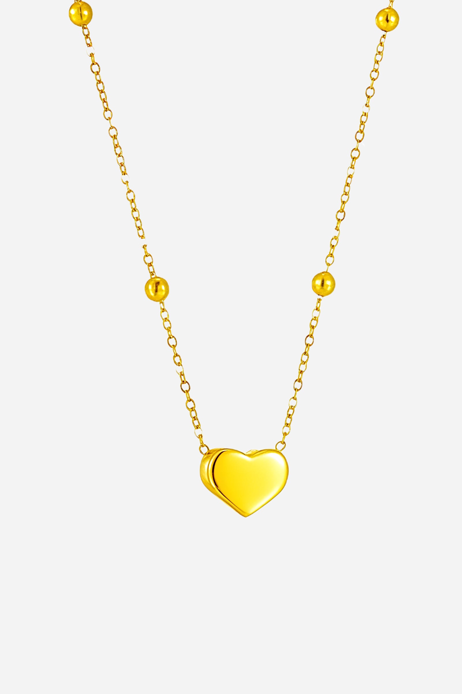 Close-up of Golden Heart Pendant Necklace showcasing the glossy heart pendant and fine chain design – GLISTIA