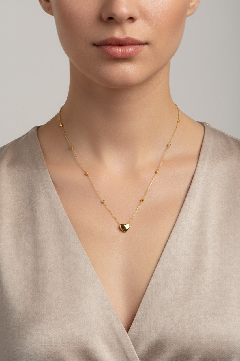 Golden Heart Pendant Necklace crafted from stainless steel with 18K PVD gold plating, featuring a timeless heart design