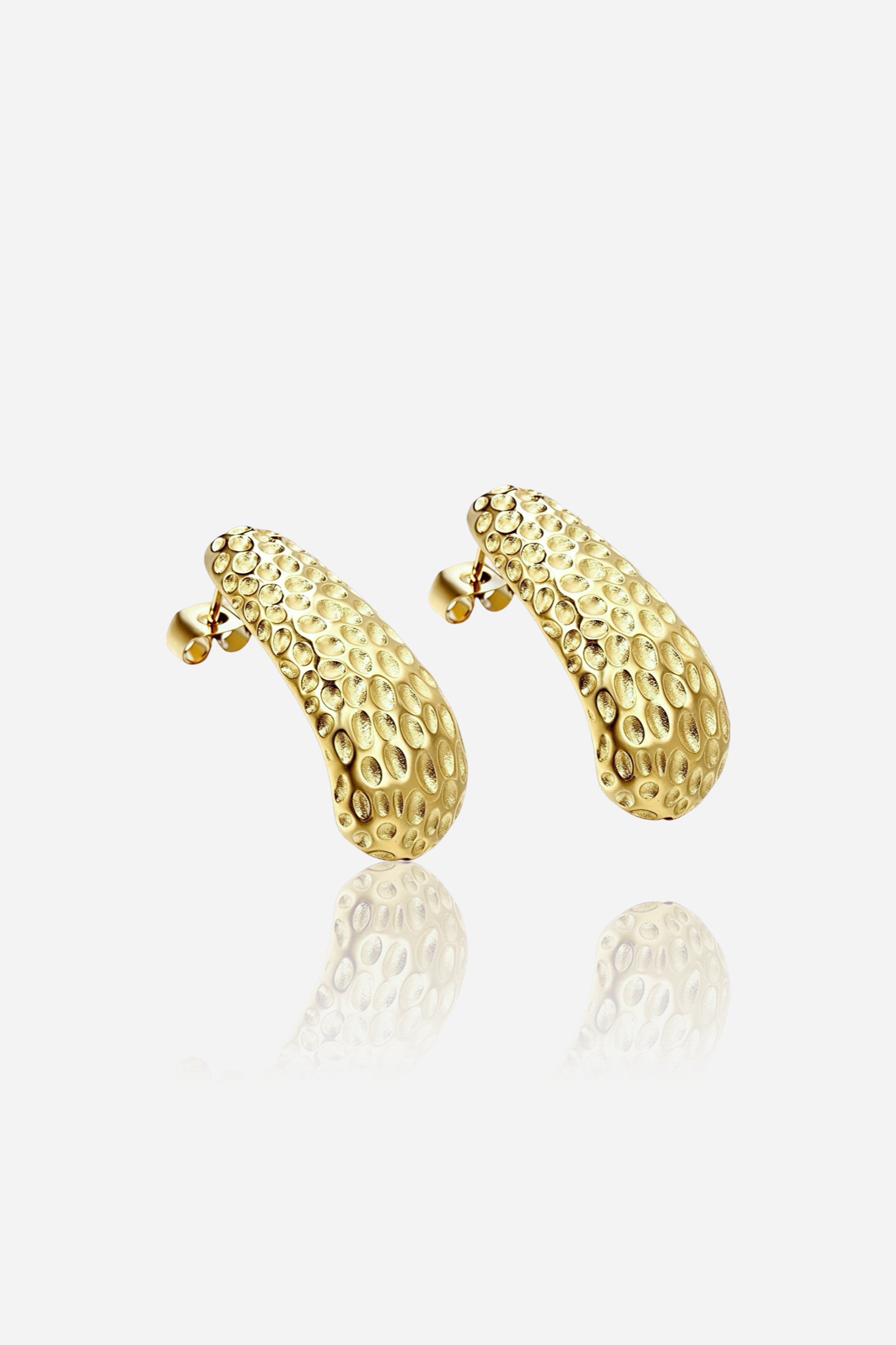 Hammered gold stud earrings crafted from stainless steel with a PVD 18K gold plated finish, featuring a curved organic shape with textured detailing – GLISTIA.