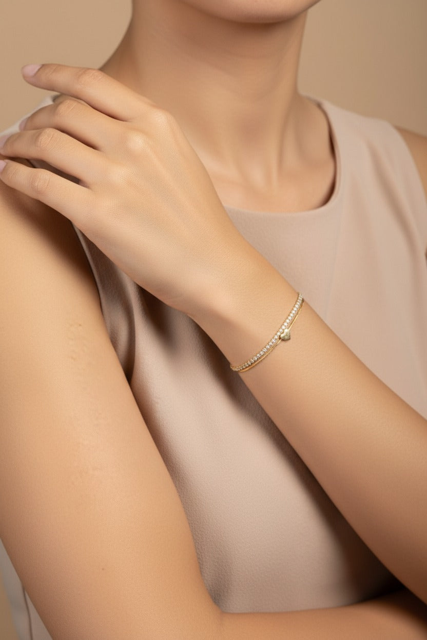 Heart Accent Dual Chain Tennis bracelet in 18K PVD gold plated stainless steel with elegant crystal heart detailing