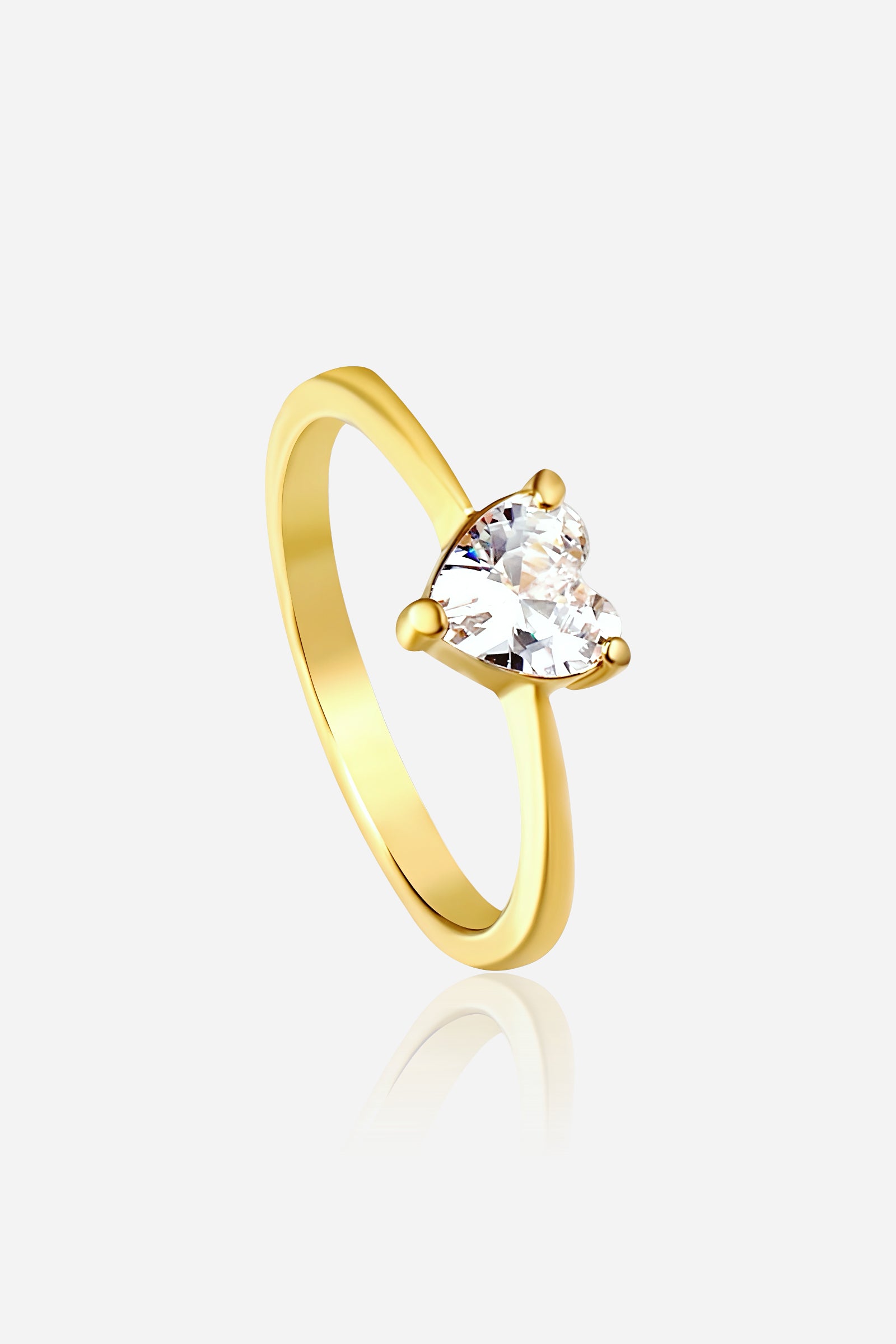 GLISTIA Heart Crystal Ring front view in PVD 18K gold plated stainless steel with clear heart-cut stone.