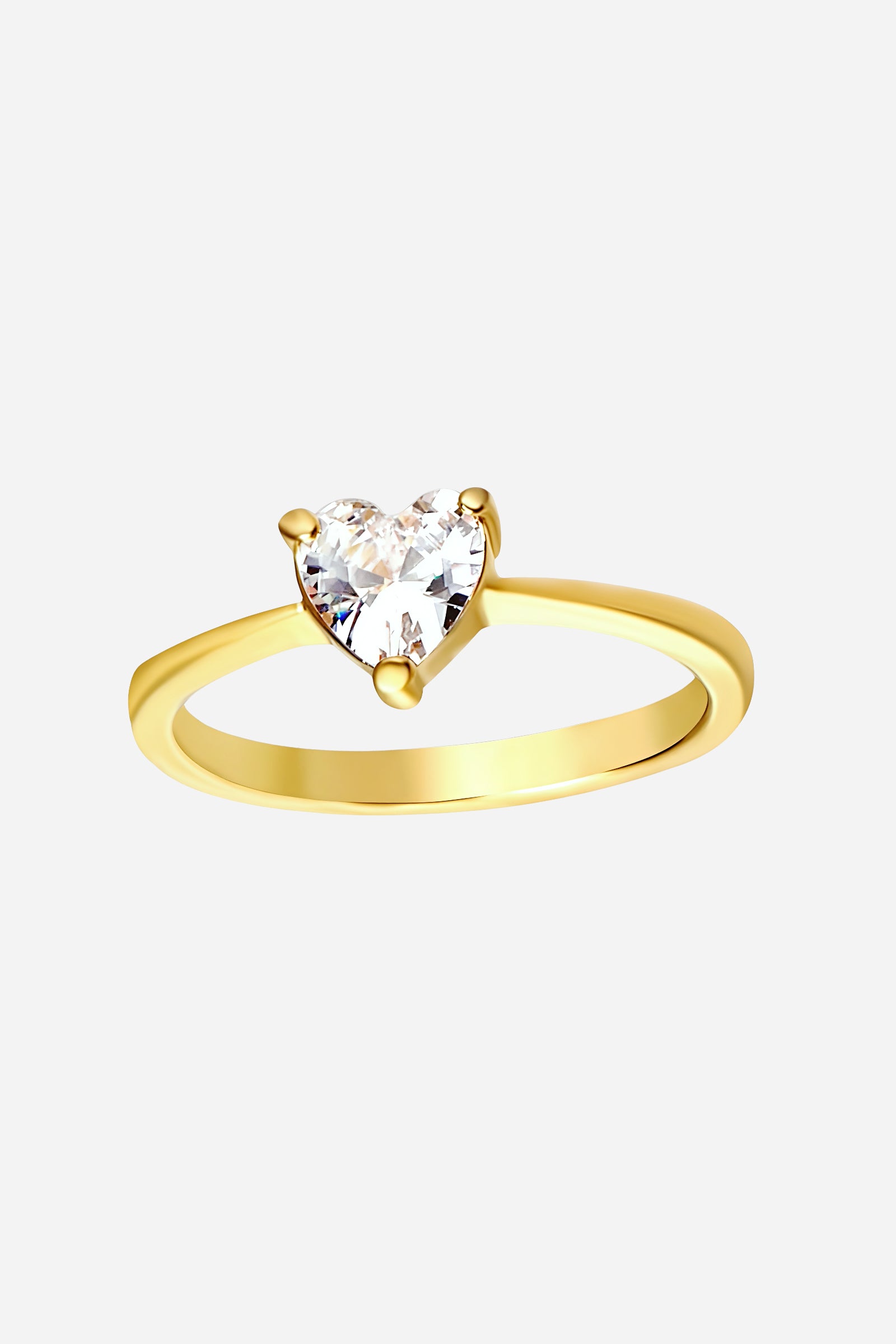 Top-view of GLISTIA gold heart crystal ring featuring a premium clear heart-shaped gemstone.