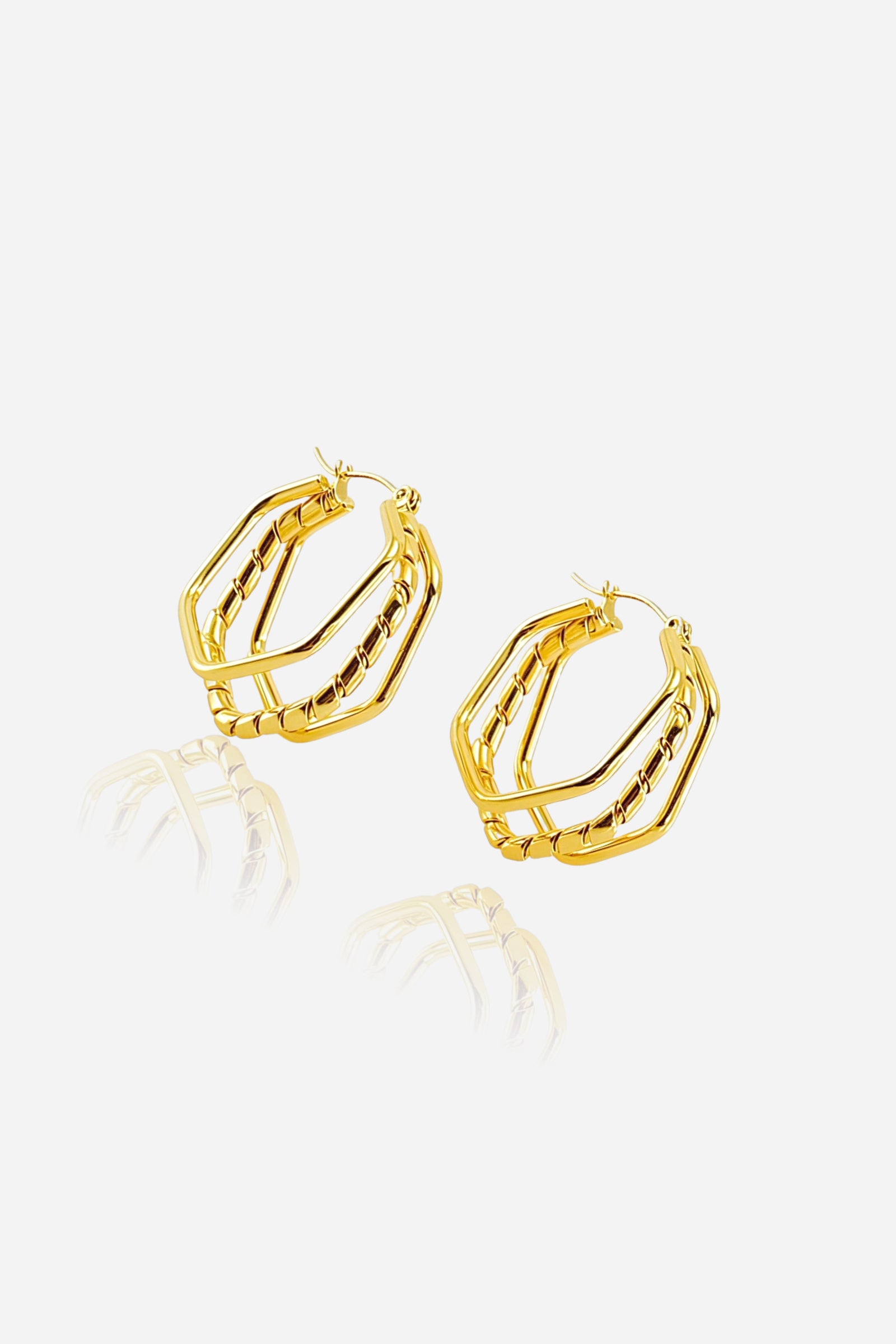 Hexagon double-layer hoop earrings crafted in stainless steel with a polished 18K gold plated finish, featuring a modern geometric design – GLISTIA