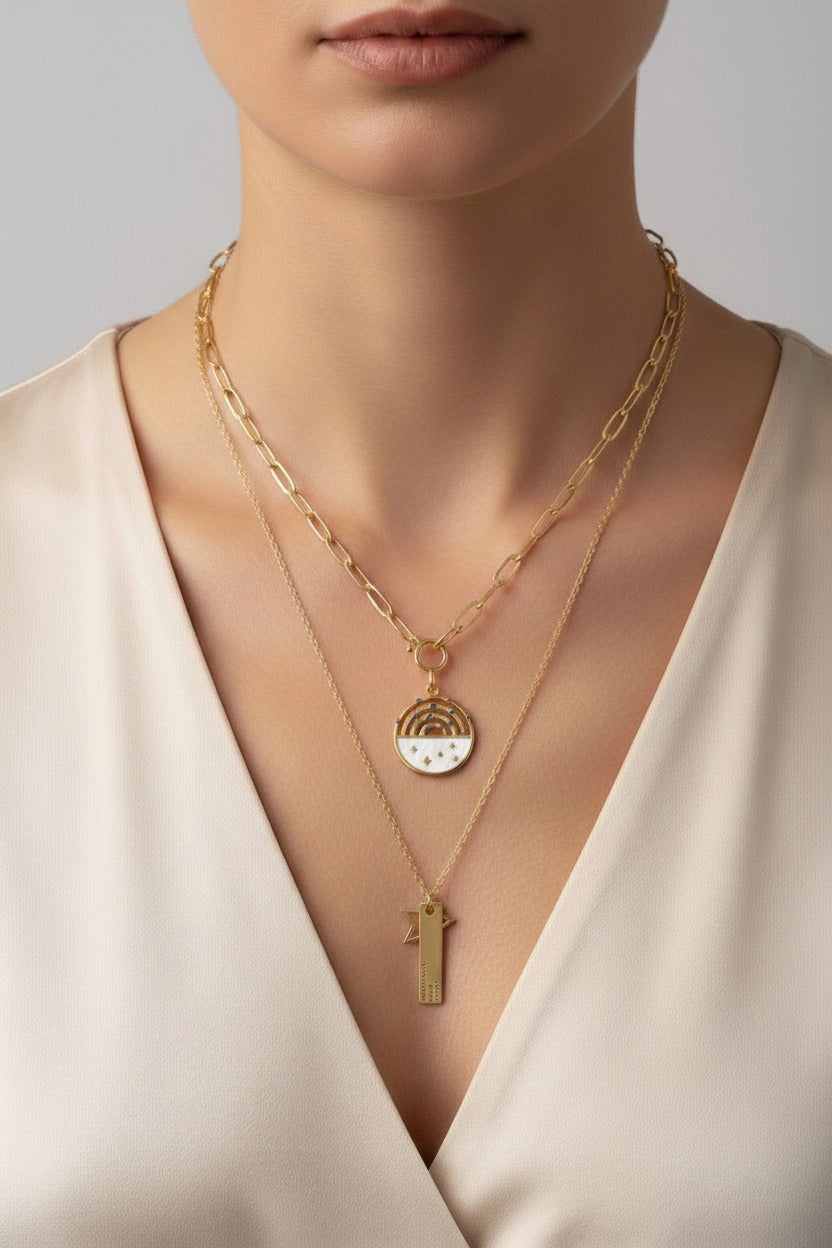 Layered rainbow and star charm necklace in 18K PVD gold plated stainless steel by GLISTIA
