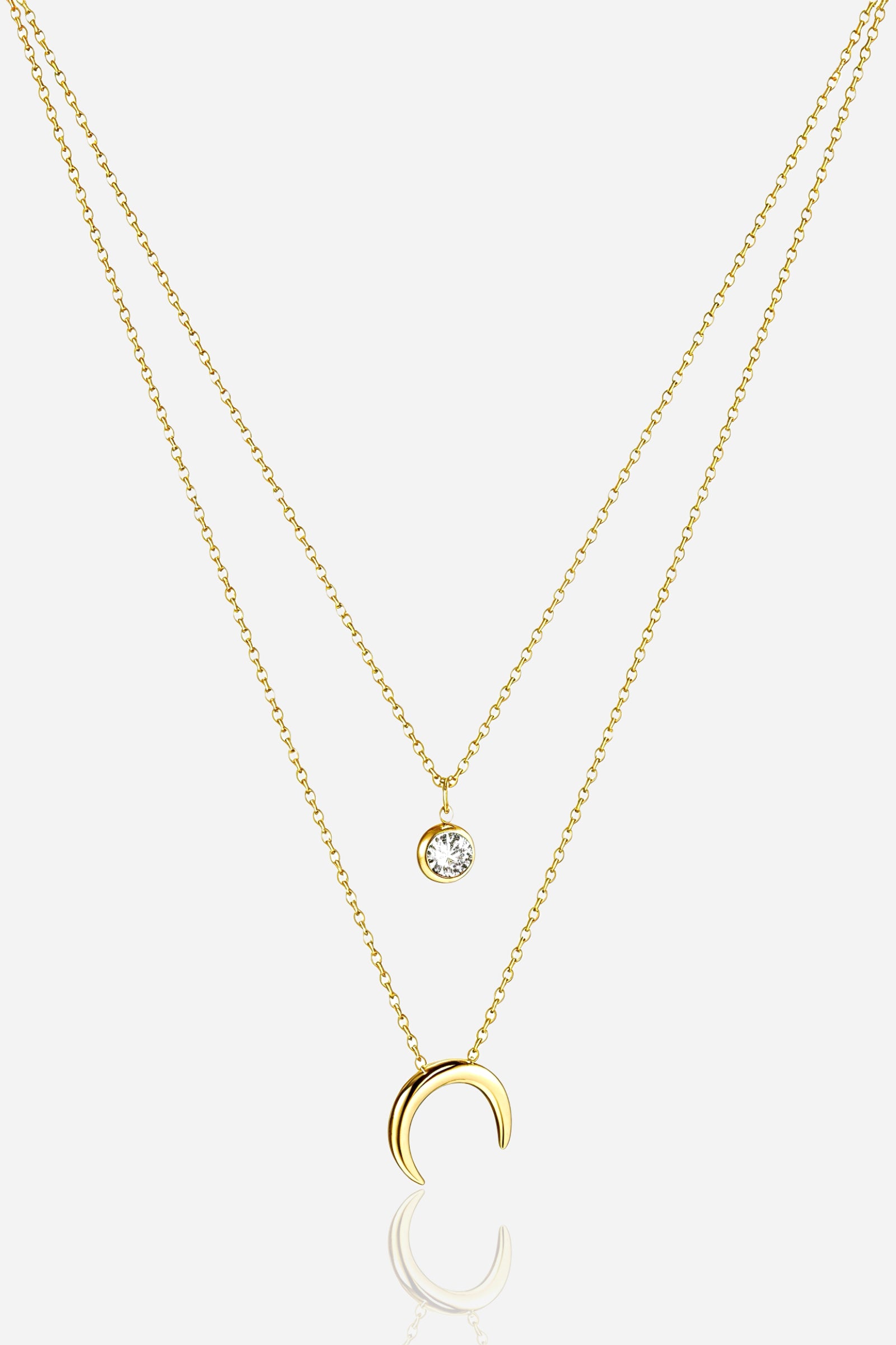 Front view of GLISTIA Luna Crescent Layered Necklace with crystal charm and moon pendant.