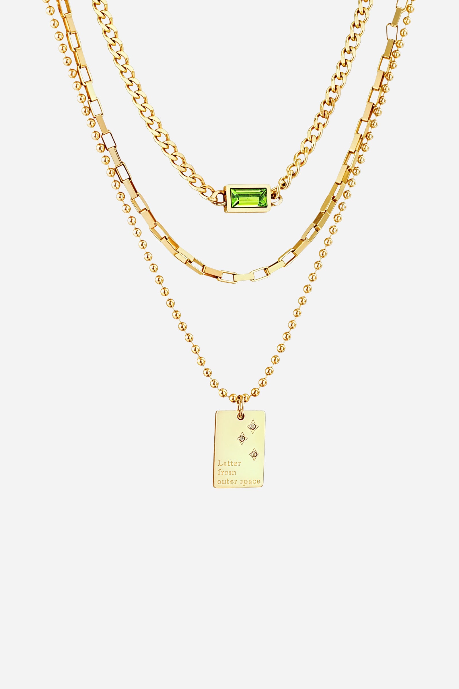 Top-view image of GLISTIA Luna Verde Layered Necklace showcasing three-layer mixed gold chains and centre gemstone.