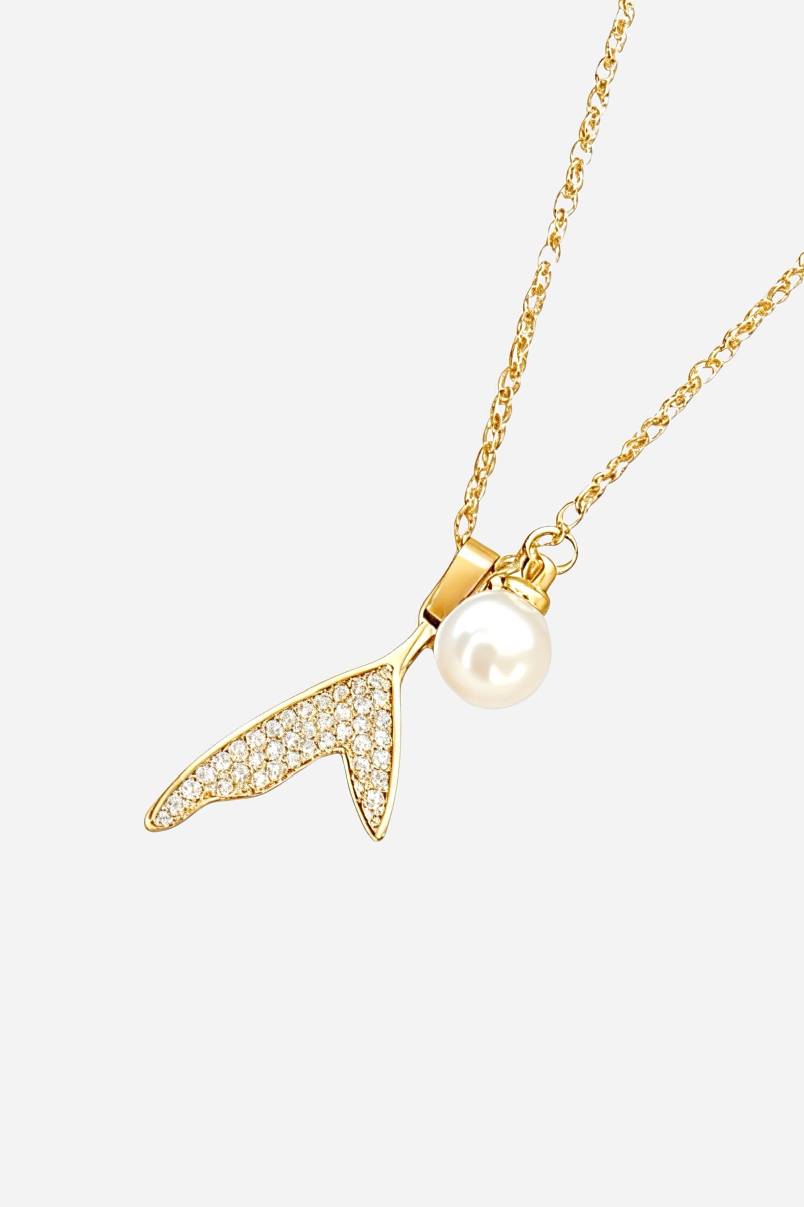 Side view of Ocean Wish Pearl Necklace featuring gold-plated S925 silver, zircon-paved tail pendant and single pearl charm – GLISTIA.