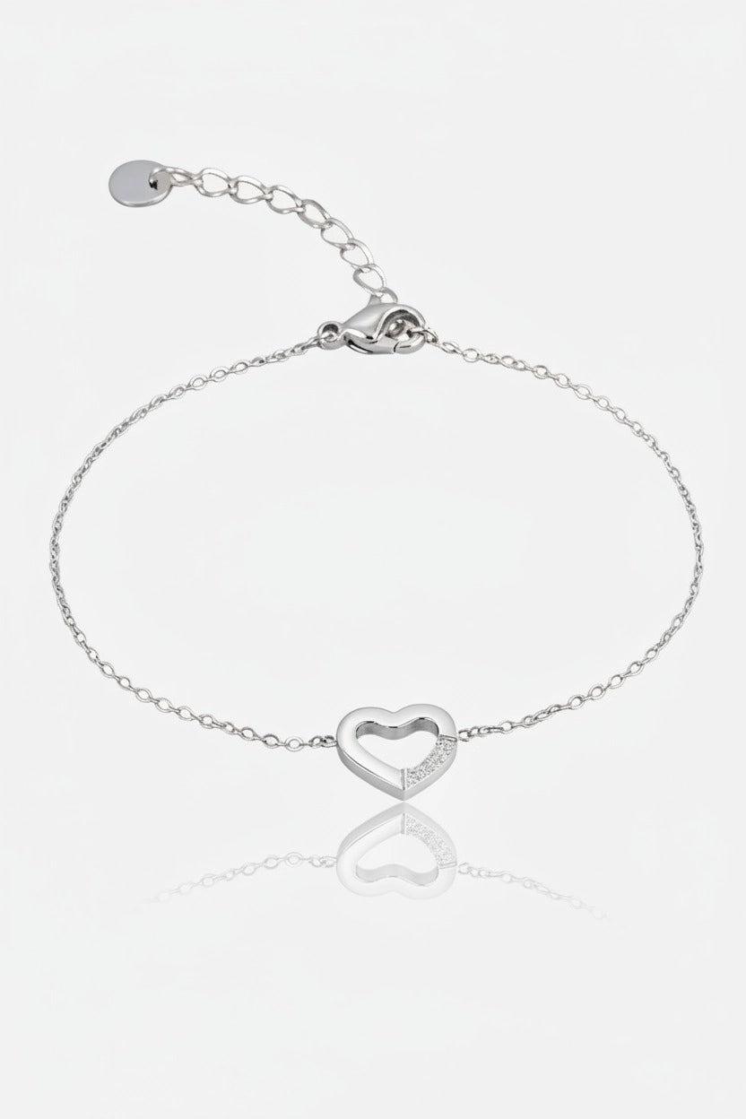 Silver stainless steel bracelet with minimalist open heart centre charm and delicate fine chain