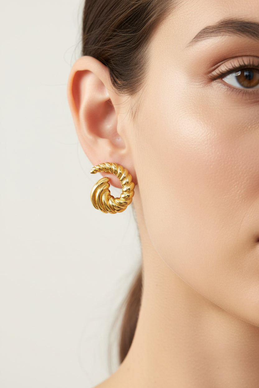 Open spiral swirl stud earrings crafted from stainless steel with 18K PVD gold plating, featuring a sculptural curved swirl design