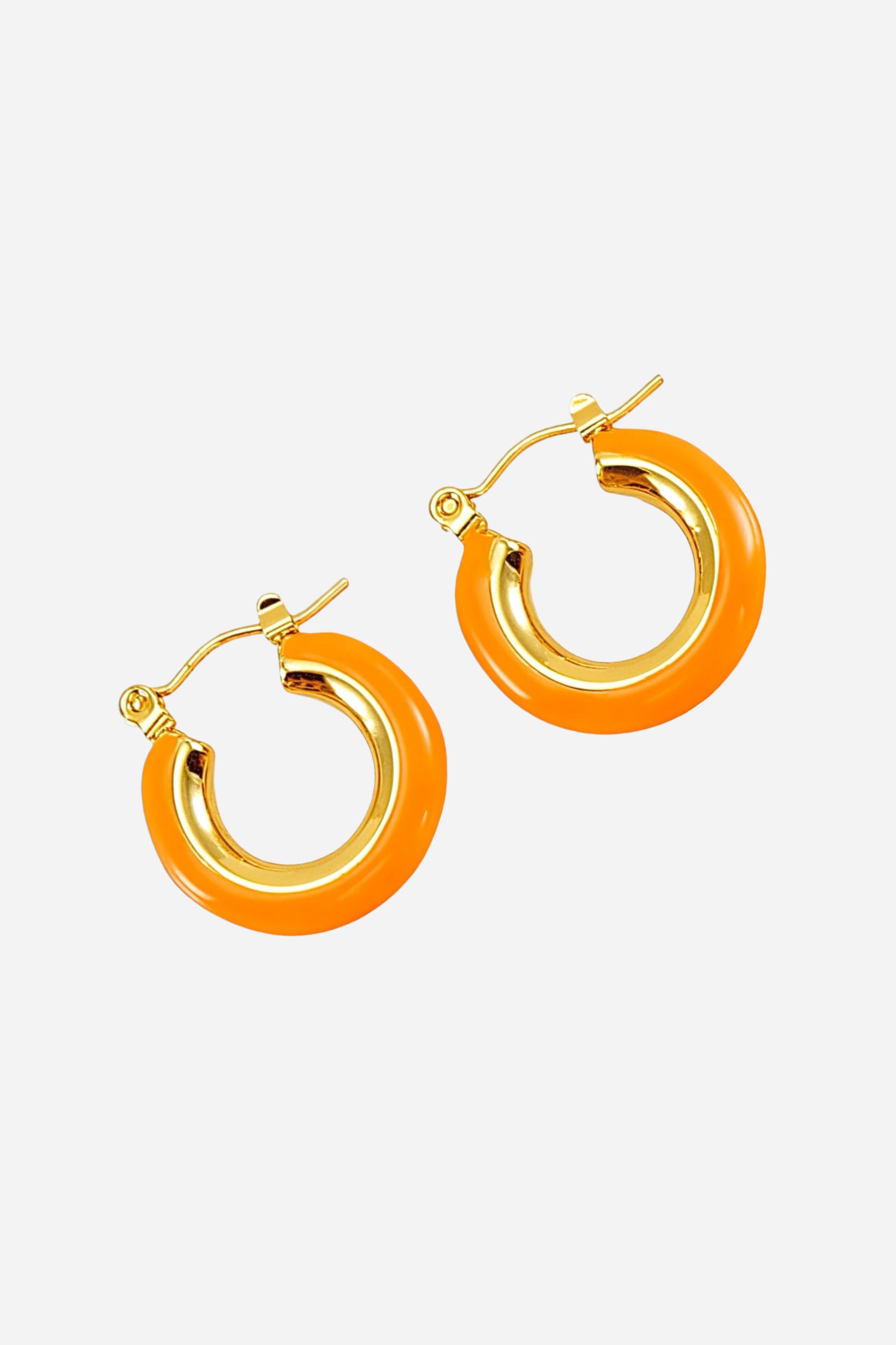 Top view of orange enamel hoop earrings showcasing a smooth glossy surface, crafted from stainless steel and finished with radiant PVD 18K gold plating – GLISTIA.
