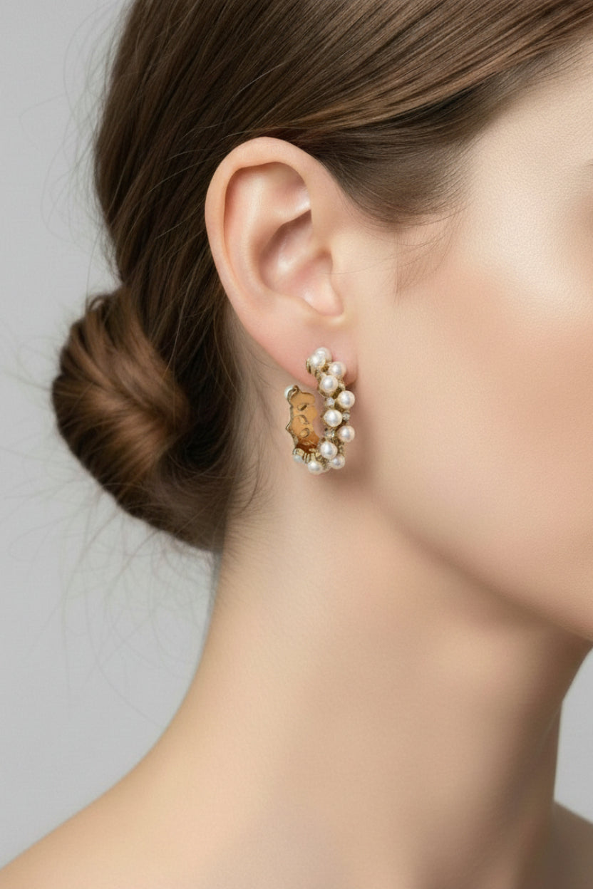 GLISTIA pearl and crystal hoop earrings in 18K PVD gold plated stainless steel, worn on ear, showing pearl and cubic zirconia detailing