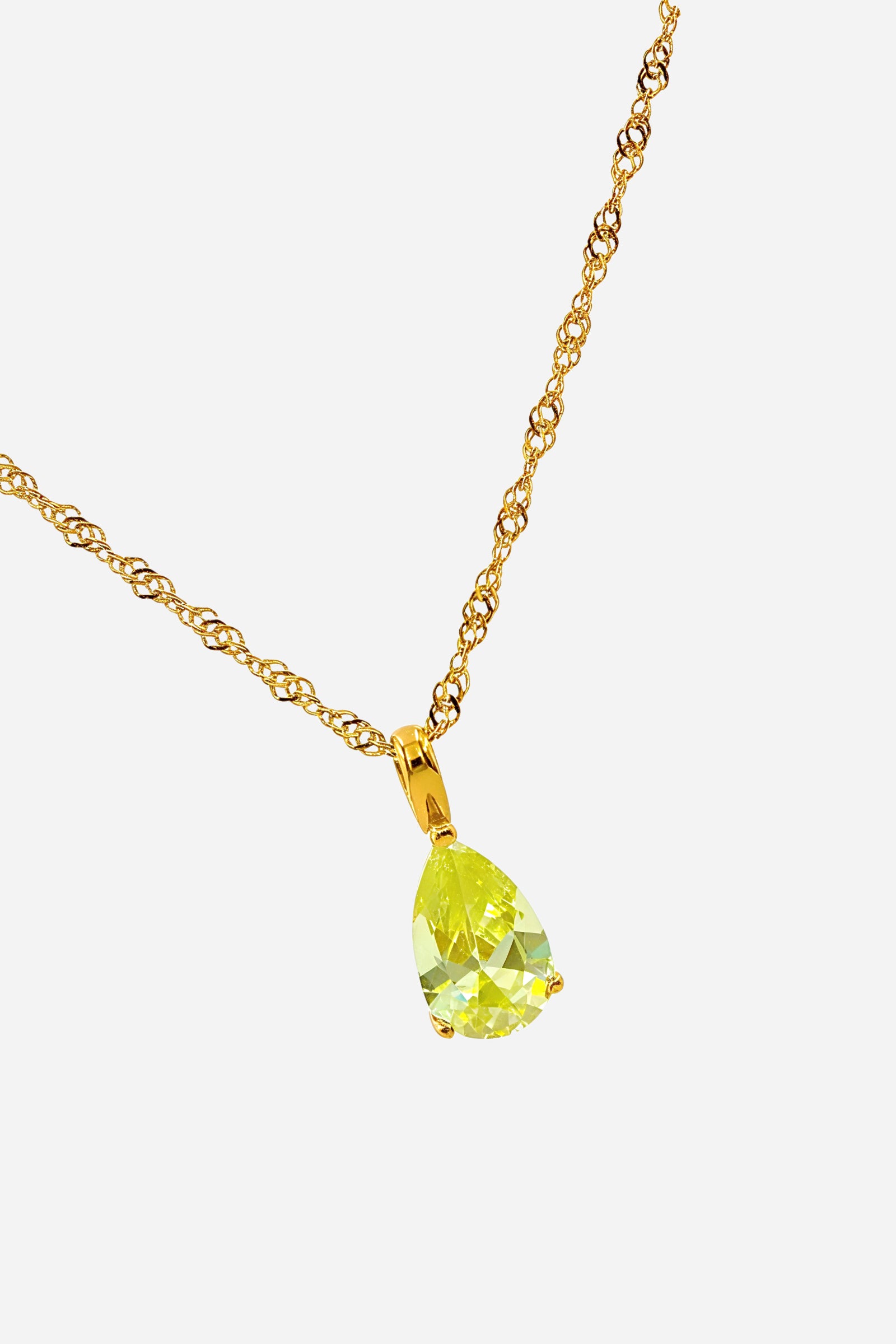 Side-angle image of Peridot Birthstone Pendant Necklace showing faceted green zircon and polished gold setting