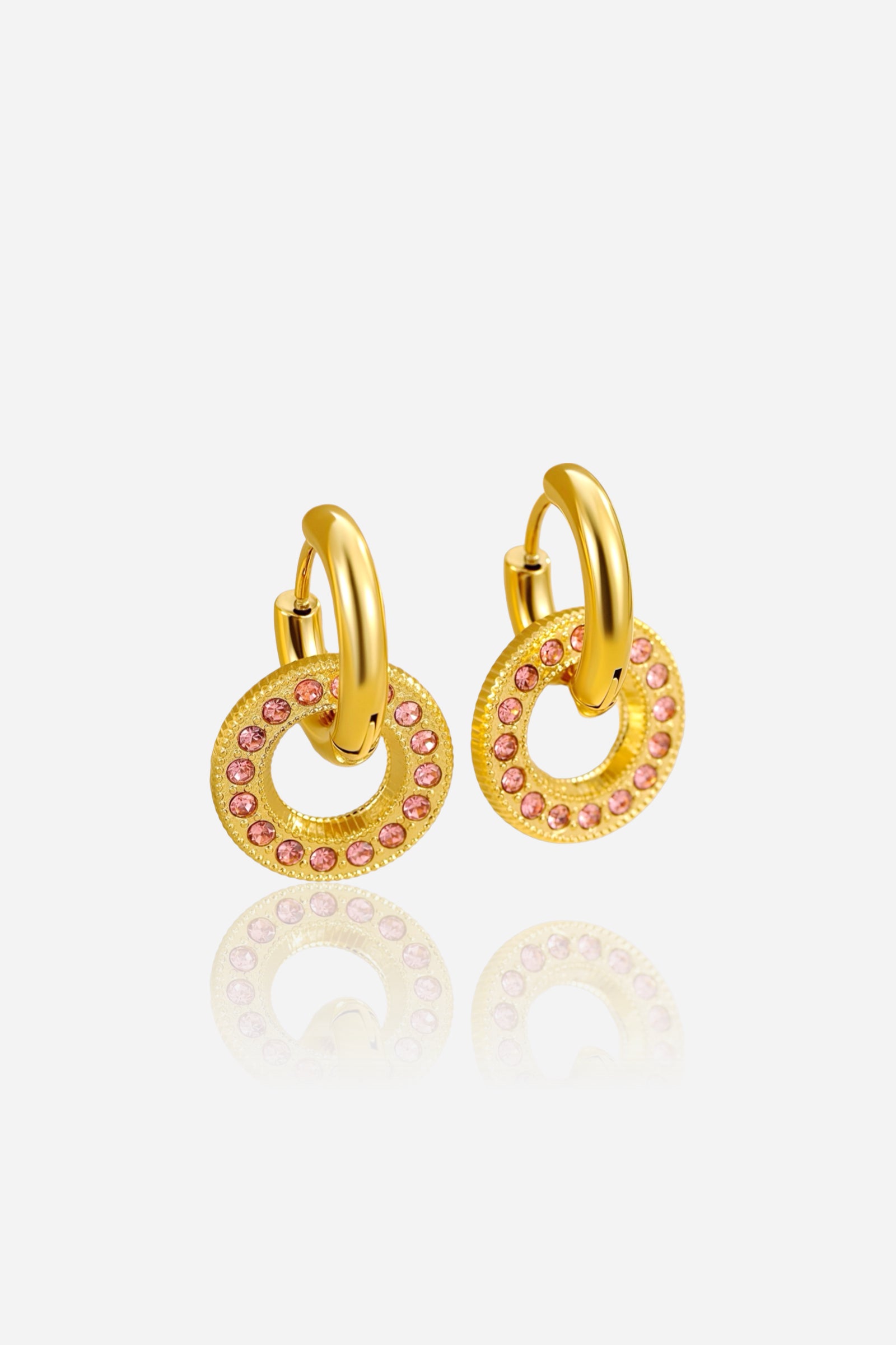 Front view of pink crystal circle hoop earrings featuring a round drop design with shimmering pink stones, crafted from stainless steel and finished in radiant PVD 18K gold plating – GLISTIA