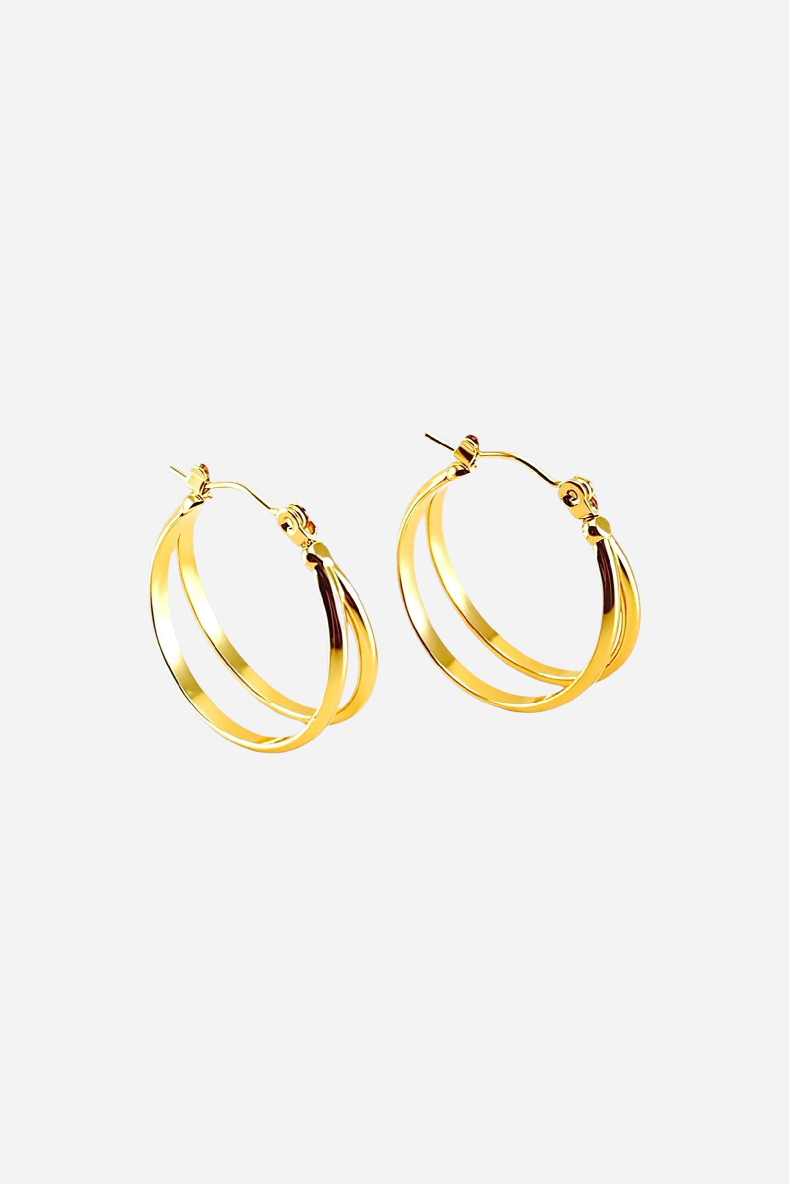 Front view polished double hoop earrings crafted in stainless steel with a smooth PVD 18K gold plated finish, featuring a dual open-hoop design with modern minimal curves – GLISTIA