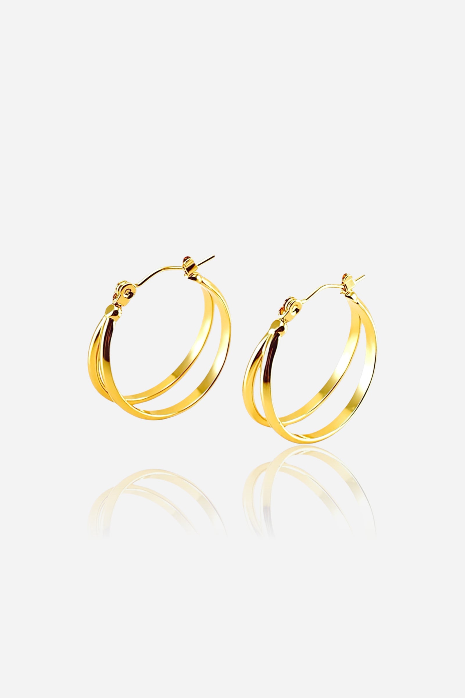 Side view polished double hoop earrings crafted in stainless steel with a PVD 18K gold plated finish, featuring smooth dual bands for a timeless elegant look – GLISTIA