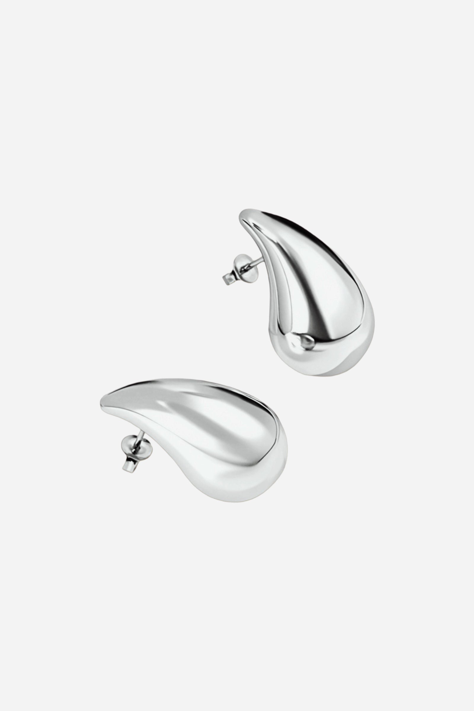 GLISTIA polished silver teardrop stud earrings crafted from high-shine stainless steel, featuring a sleek curved drop design with a modern reflective surface on a white background.