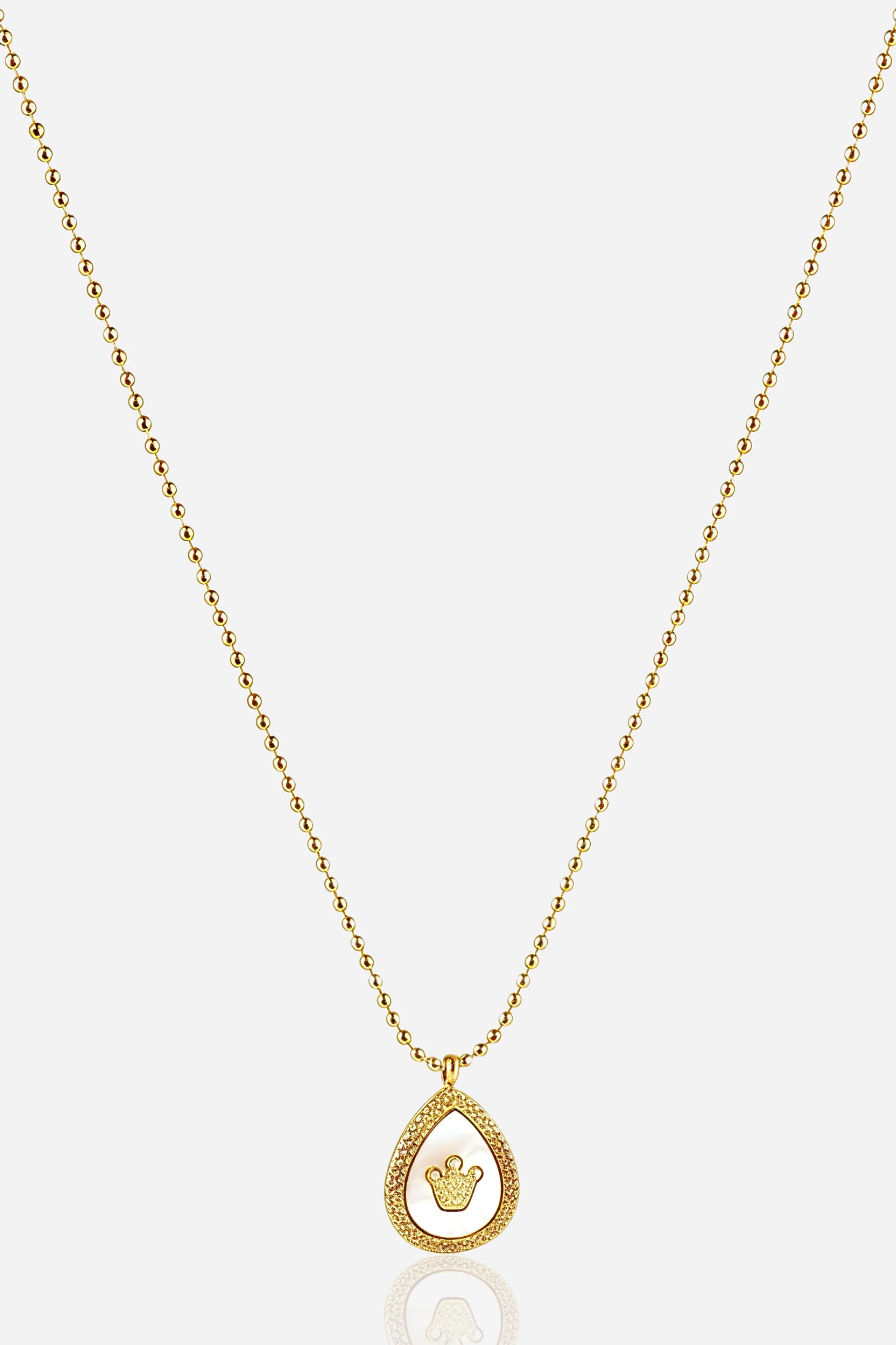 Zoom-view image of GLISTIA Regalia Crown Necklace showcasing the 18K PVD gold plated teardrop pendant.